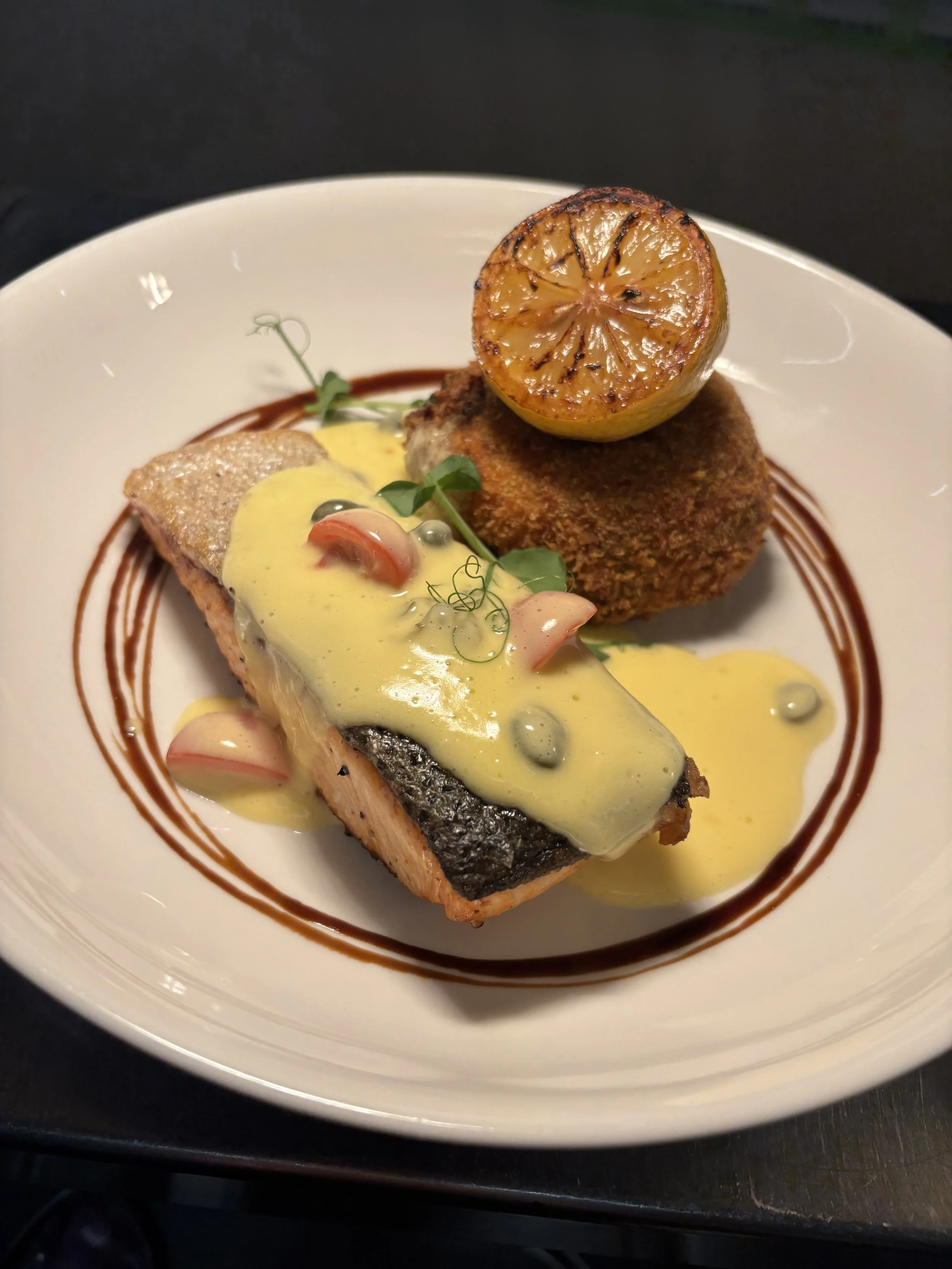 Pan Roasted Salmon, Black Pudding and Scallion Croquette and a Tomato and Caper Hollandaise Sauce.