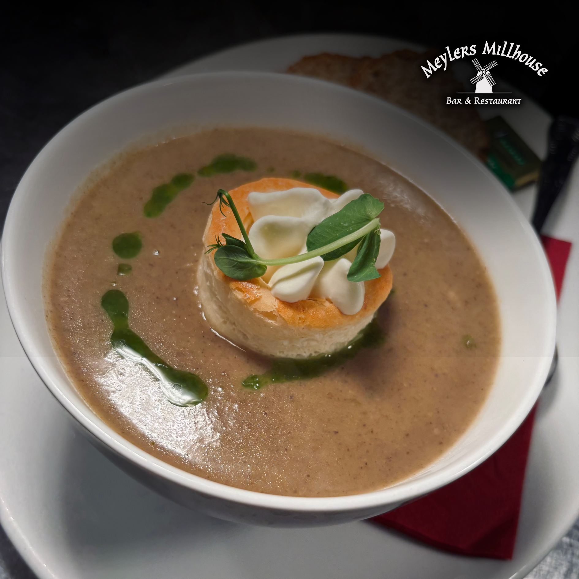 Cream of Mushroom Soup, en Croute, topped with Cream Puff Pastry.