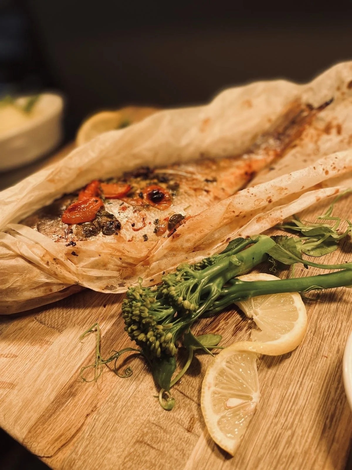 Oven Baked whole Sea Bass, with our homemade Tomato and Caper Salsa.