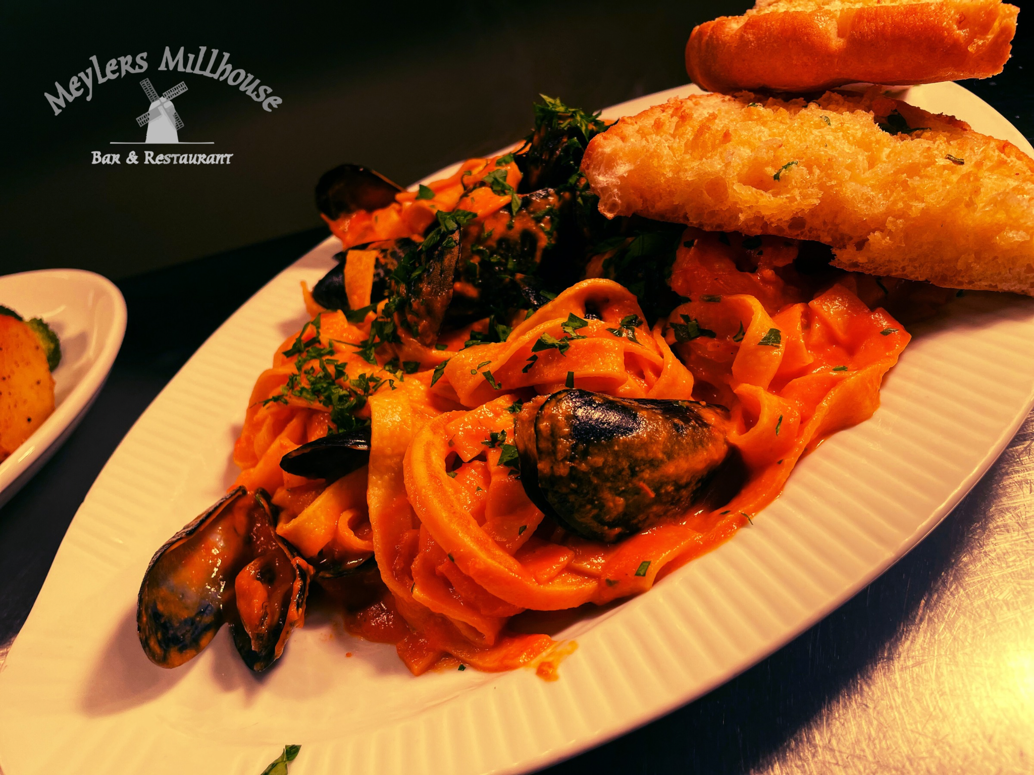 Seafood Penne Pasta, Tomato Cream Sauce with Mussels and Prawns.
