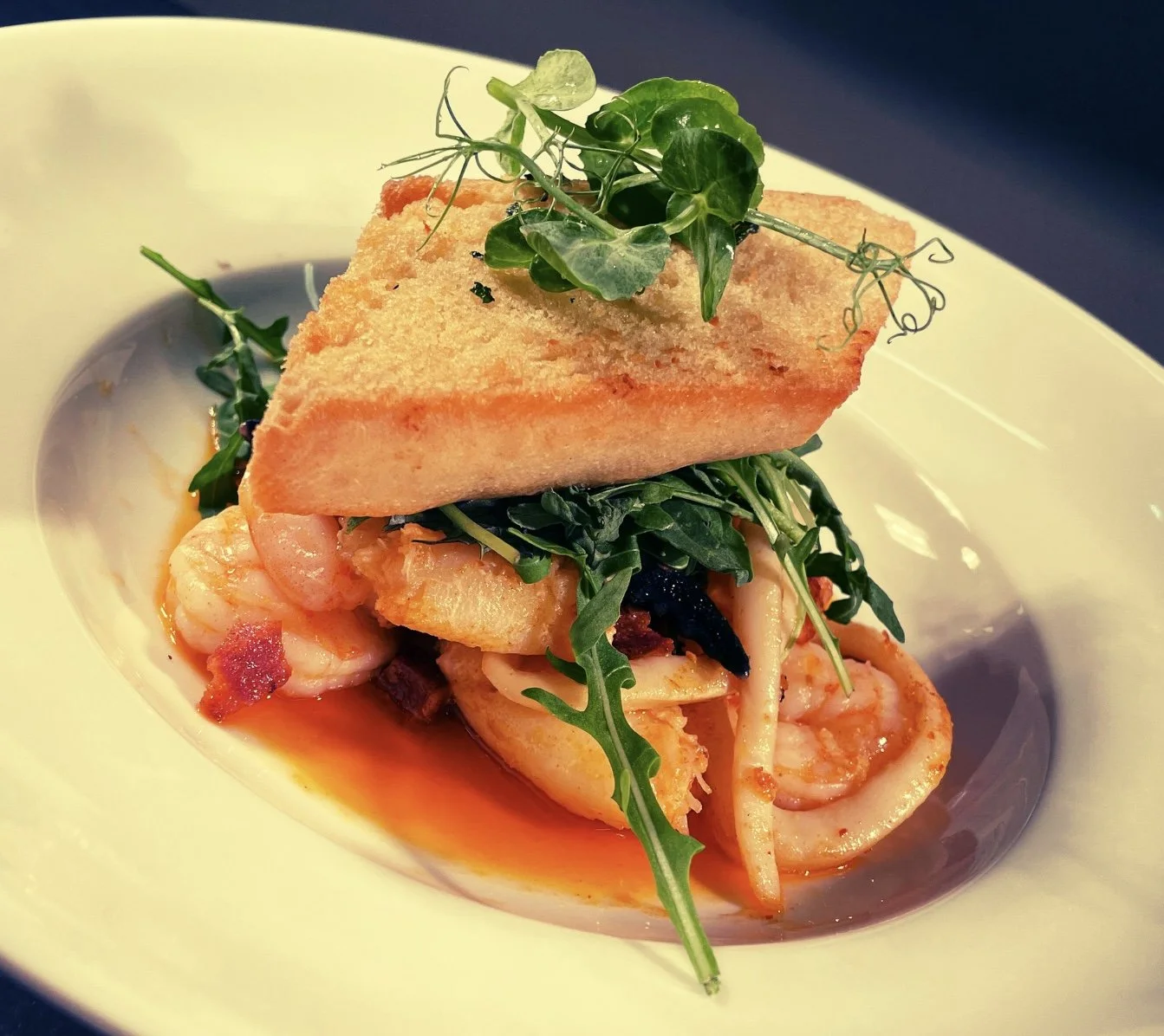 Prawn and Calamari Pil Pil - Olive Oil, Chorzio and Chilli emulsion.