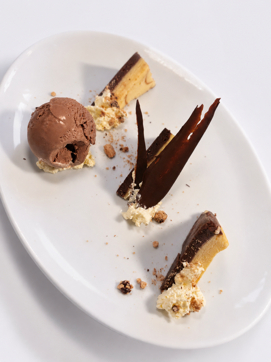 Deconstructed White Chocolate Cheesecake, Chocolate Scúp Ice-cream, Honeycomb.