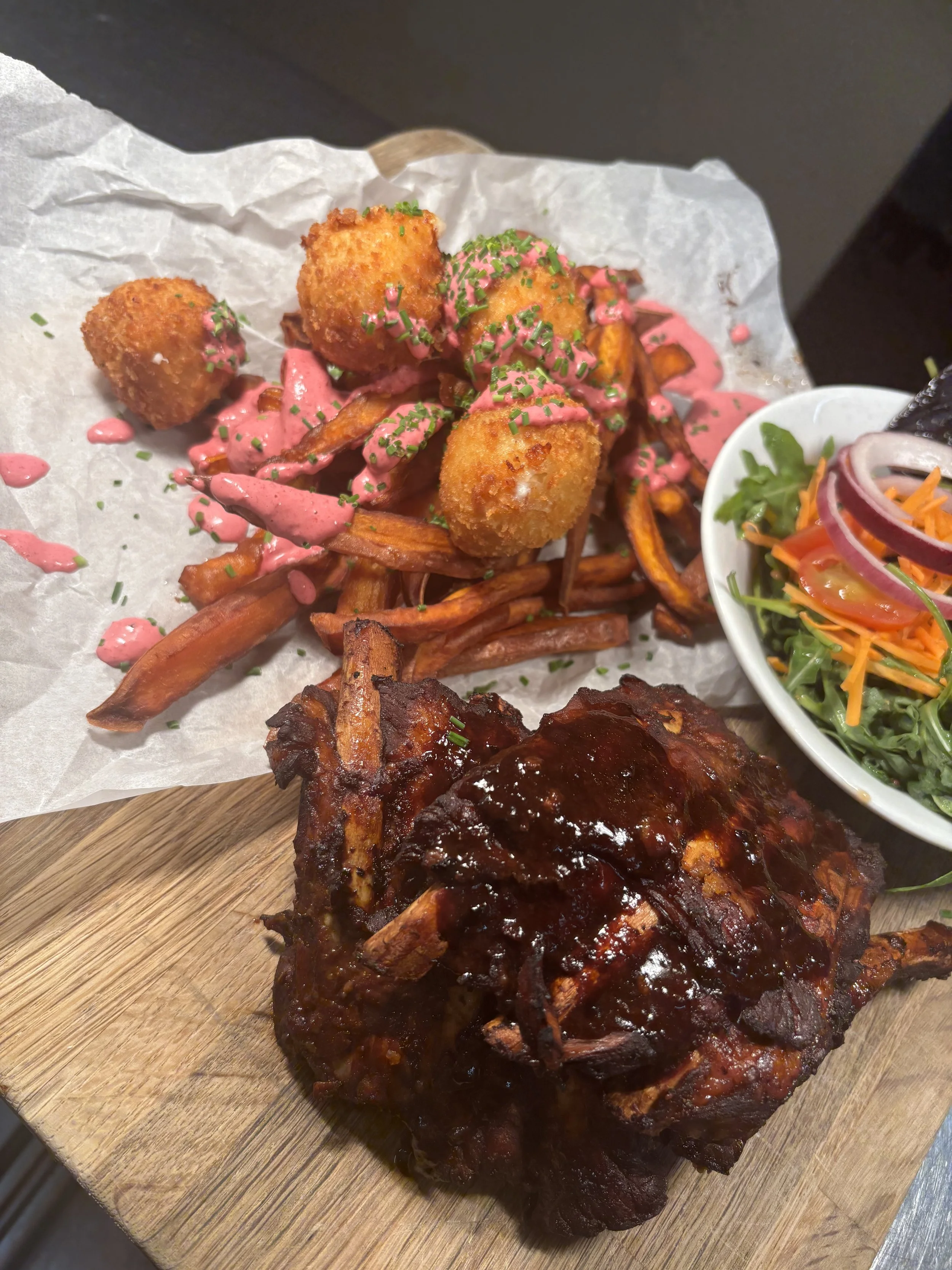 Braised Coca Cola Pork Ribs, served with handcut Sweet Potato Fries, Goats Cheese Bon Bons and a Beetroot Aioli. 