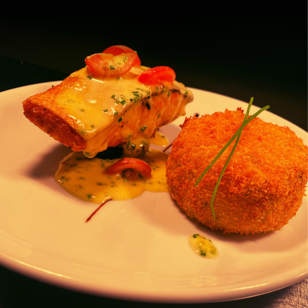 Oven Baked Darne of Salmon with Tomato and Chive Beurre Blanc, with a Spinach and Parmesan Croquette