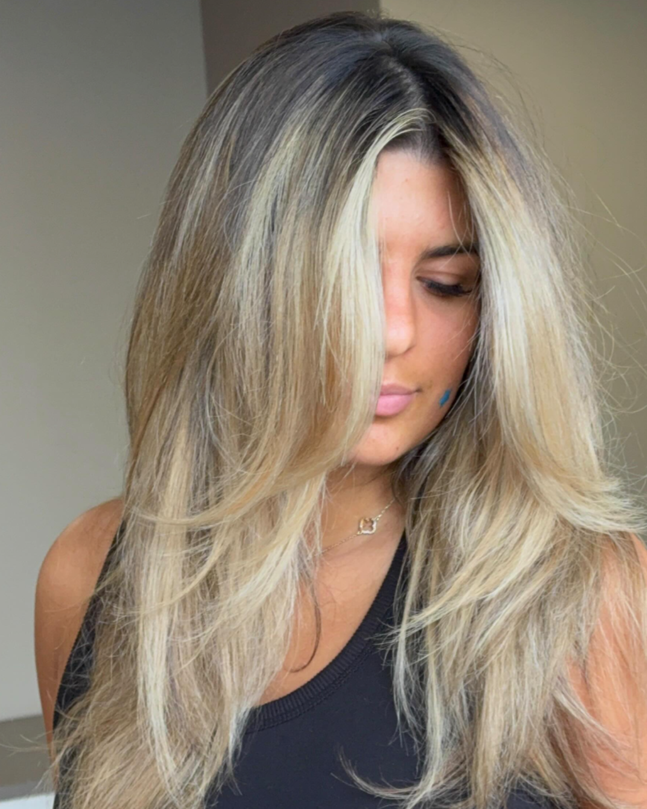 Face-framing blonde highlights at a hair salon in Columbia, SC