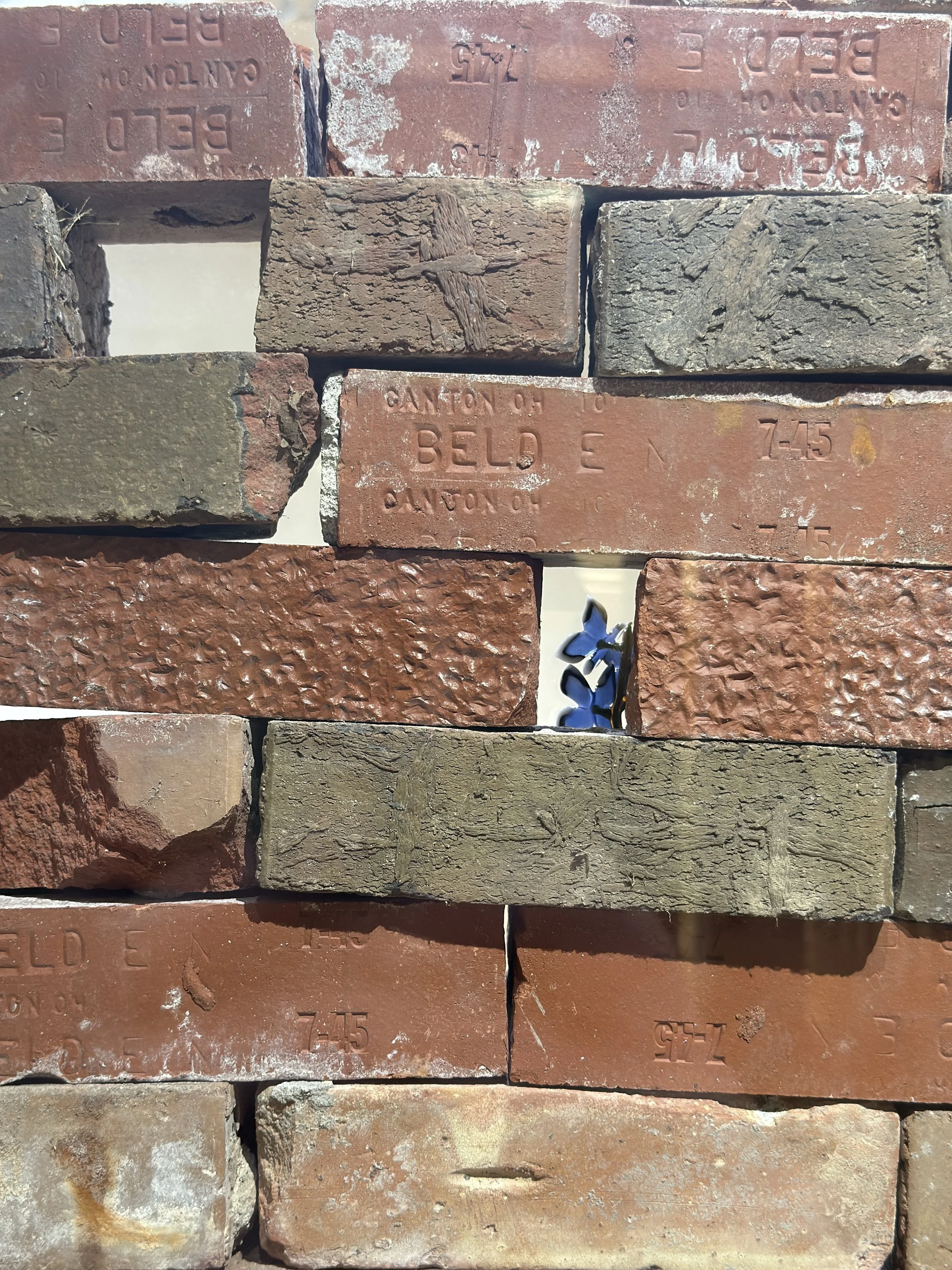 Encroachment, borosilicate glass, found brick, 69" x 10" x 34", 2025