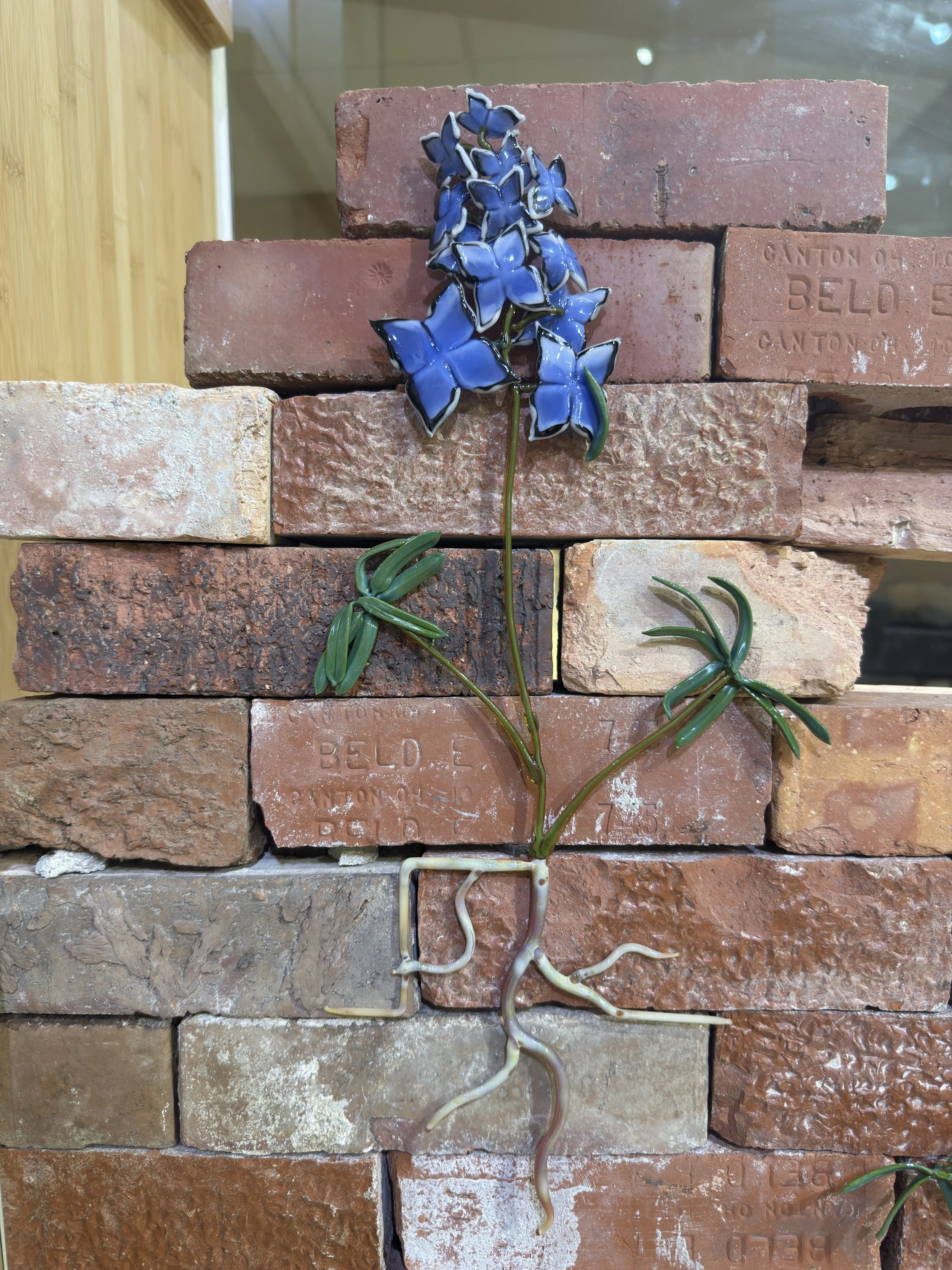 Encroachment, borosilicate glass, found brick, 69" x 10" x 34", 2025
