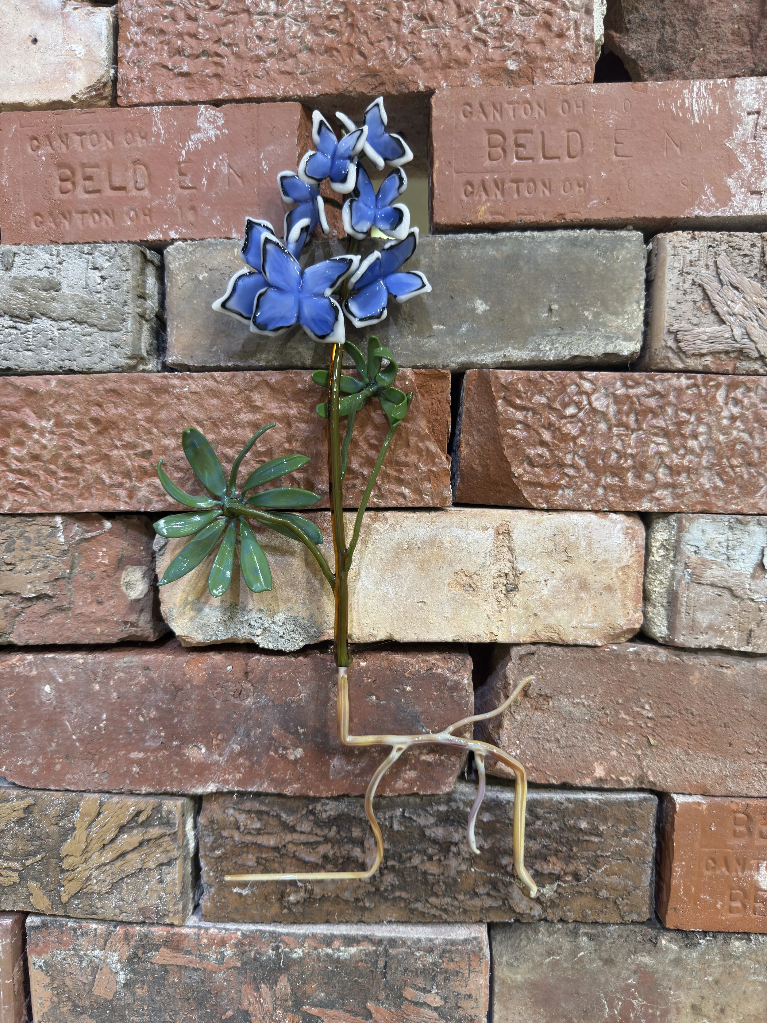 Encroachment, borosilicate glass, found brick, 69" x 10" x 34", 2025