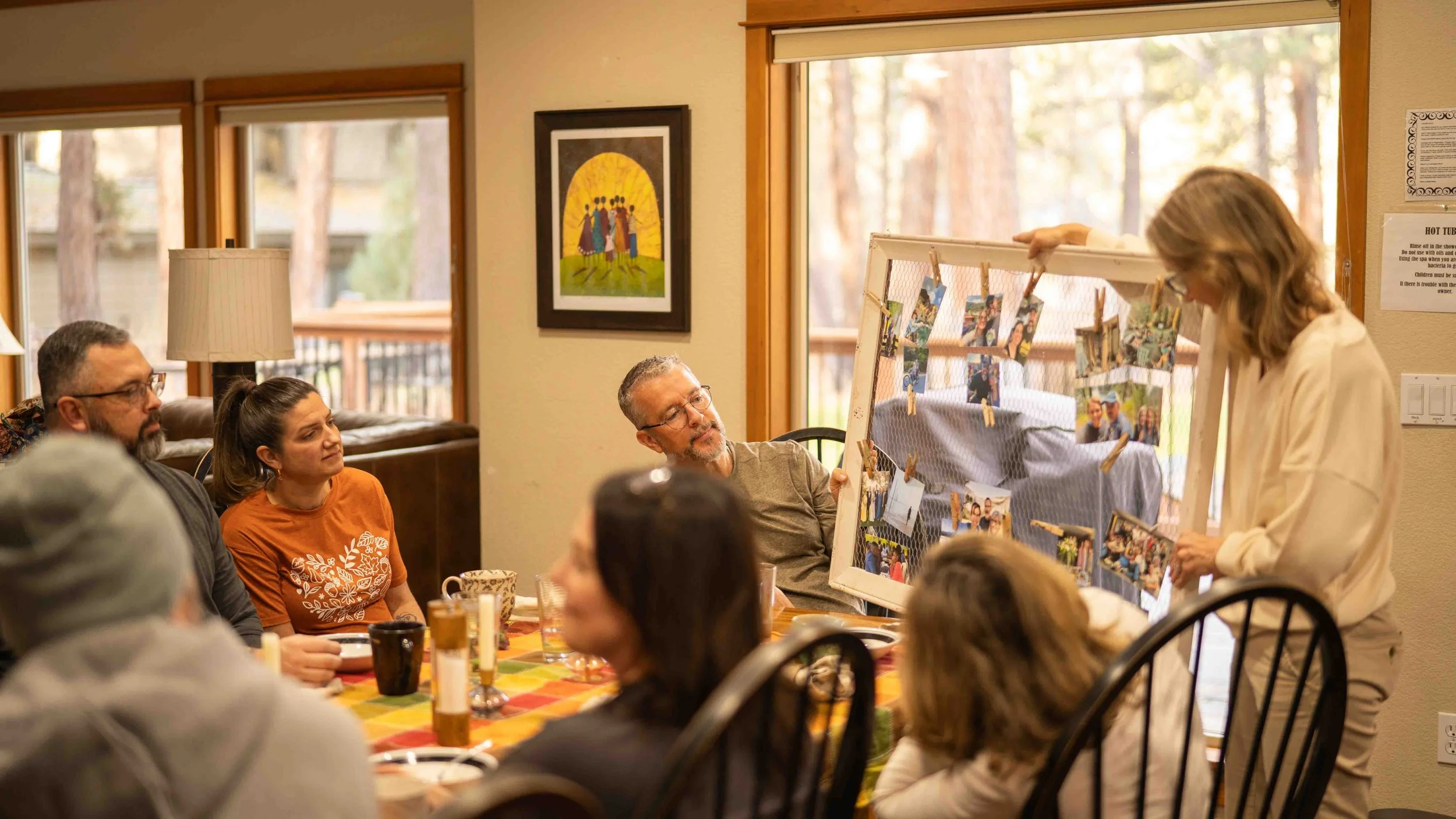 Retreat couples gathering around a table for food and spiritual guidance at The Table Retreats
