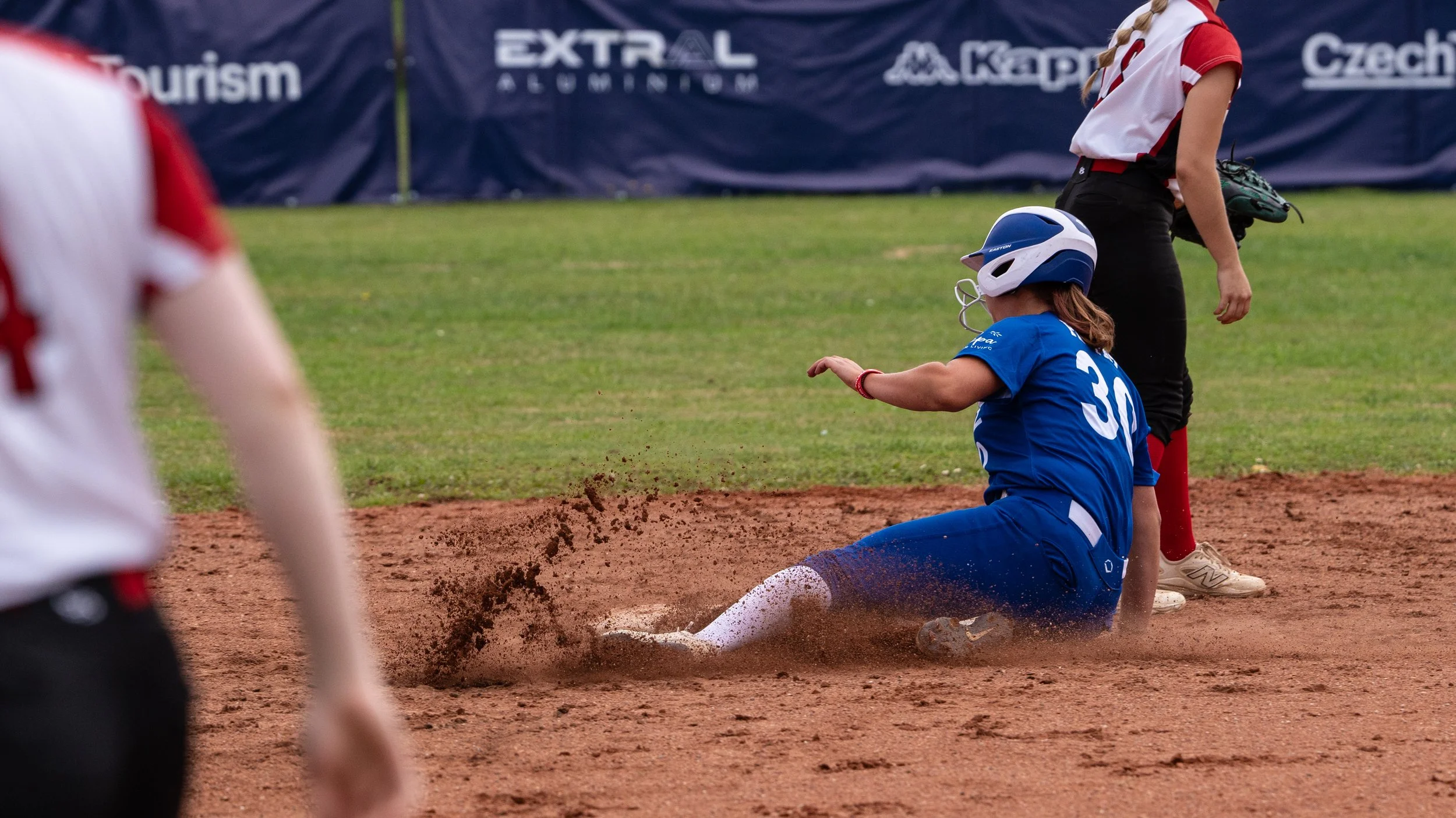 Hellas National Softball player sliding during WBSC European Championship match 2026