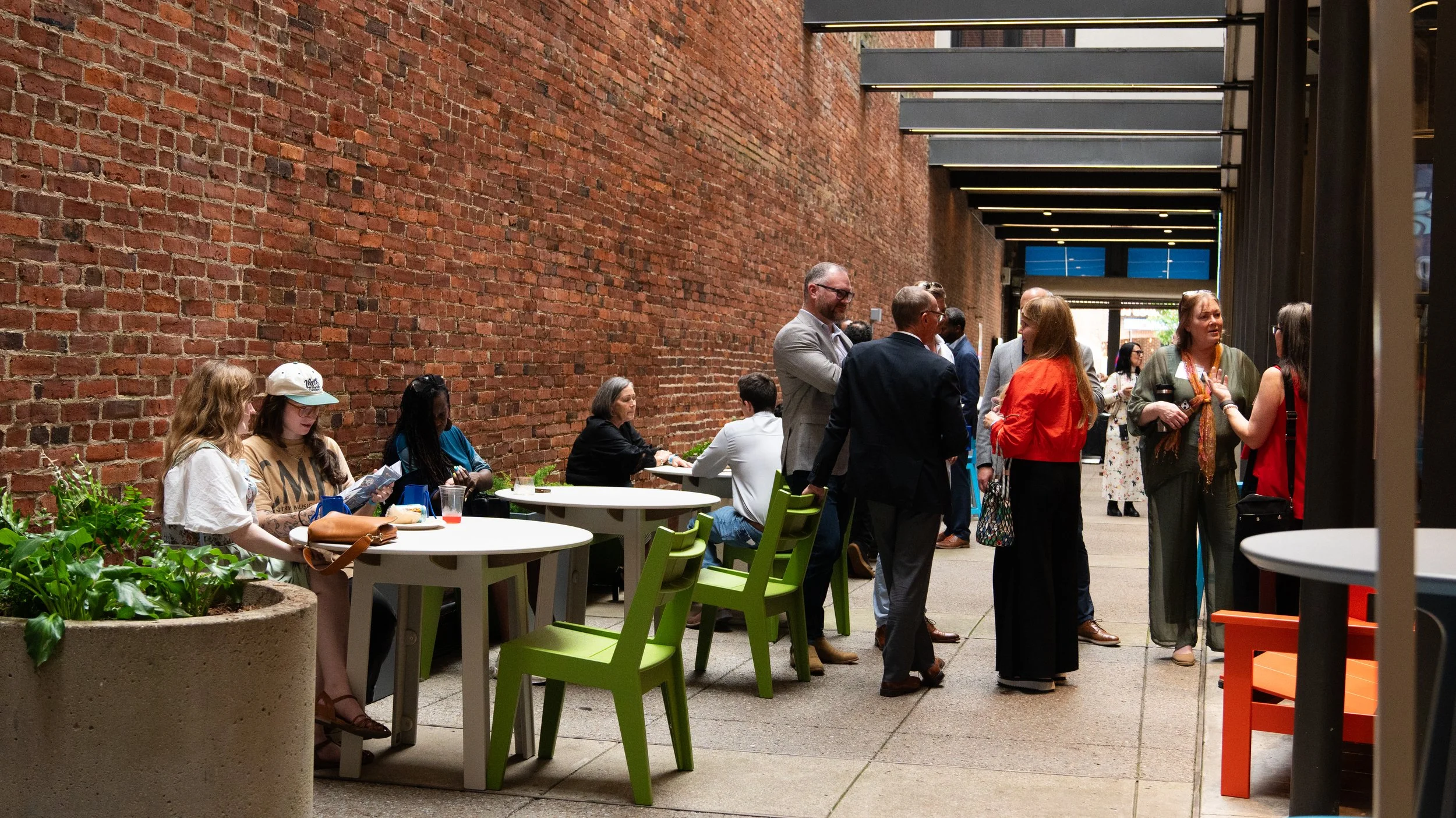 Community members gathering outside at the Civic Design Center's 25th anniversary celebration