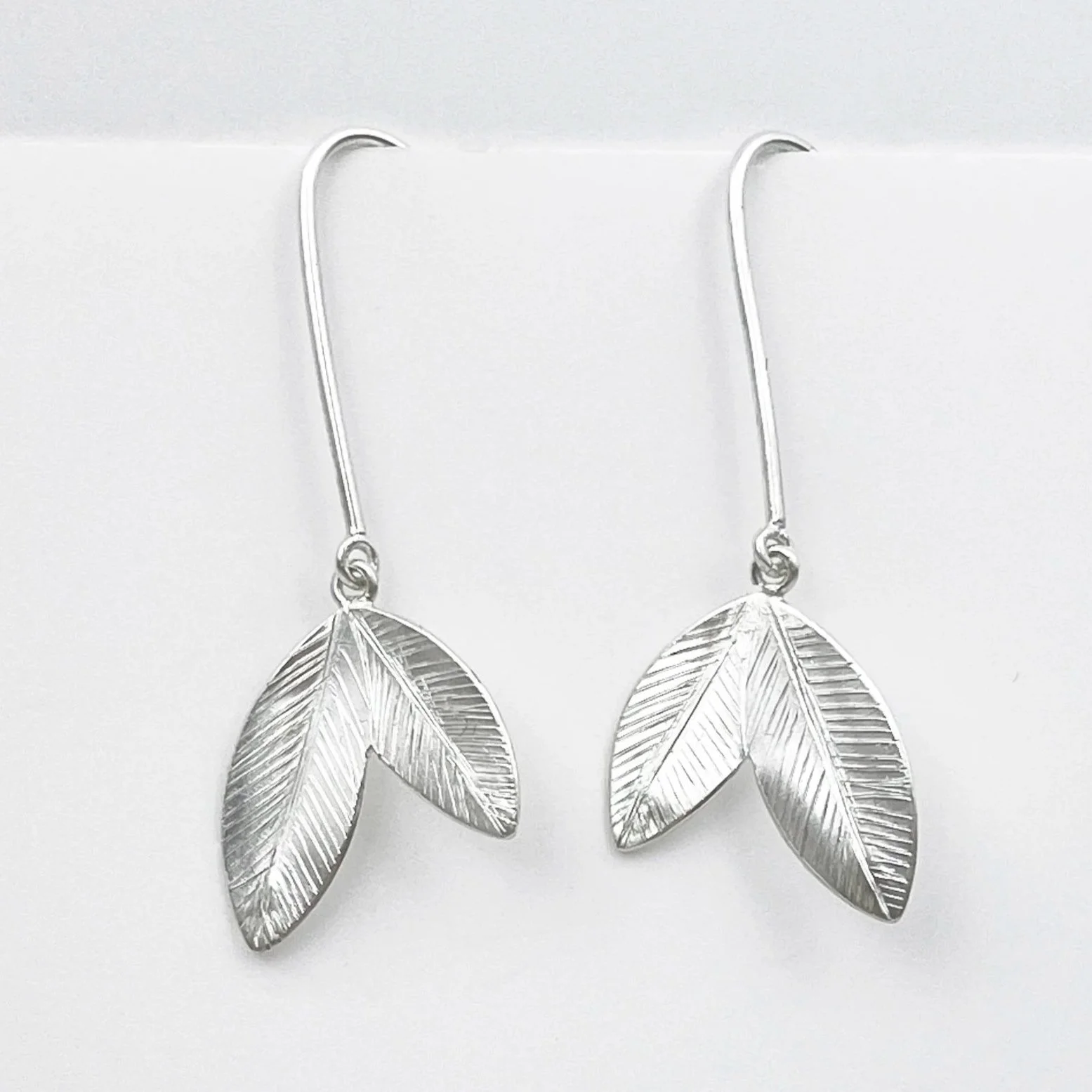 LeafSignet2EarringwHooks_hanging.jpg