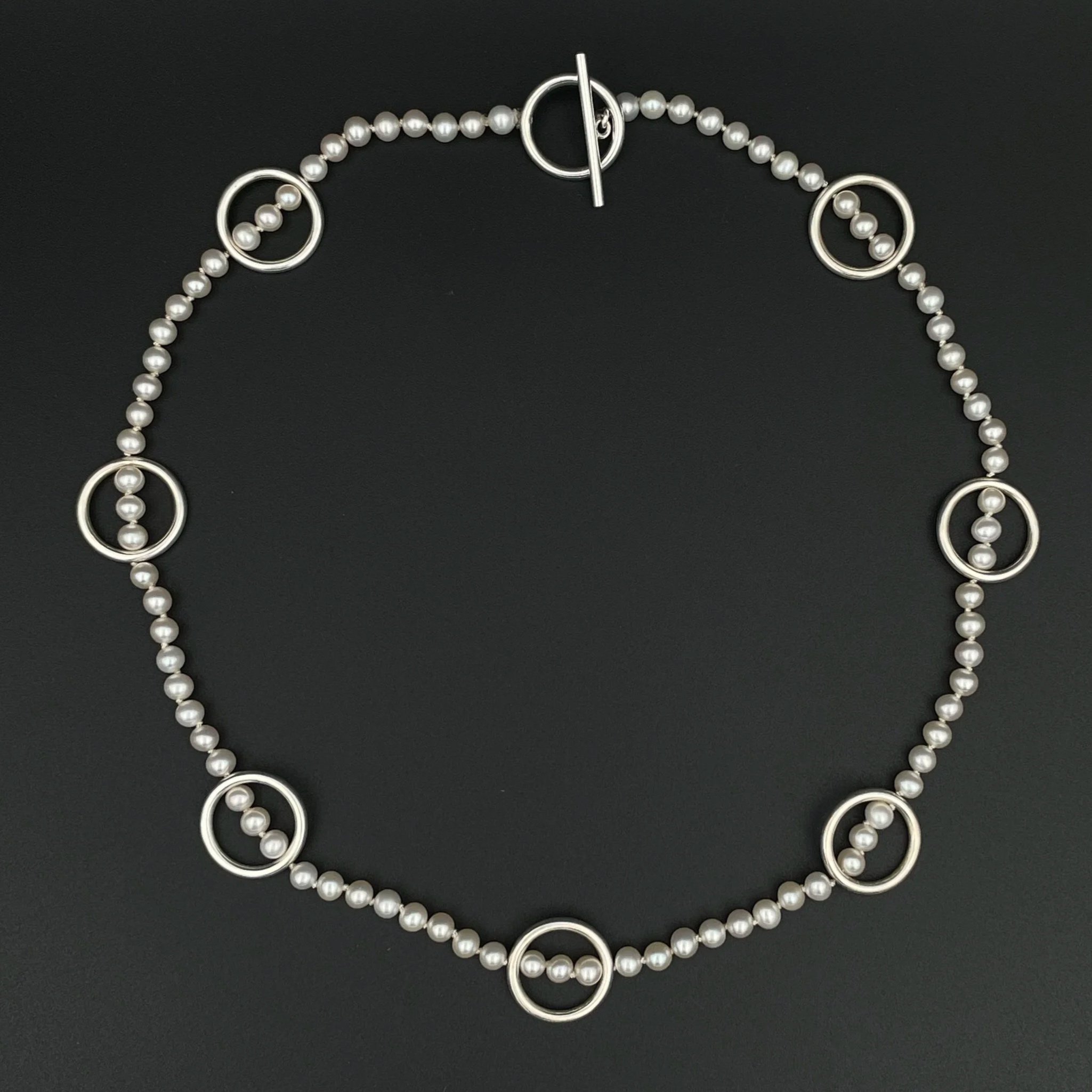 PearlRingNecklace_topviewBlack.jpg