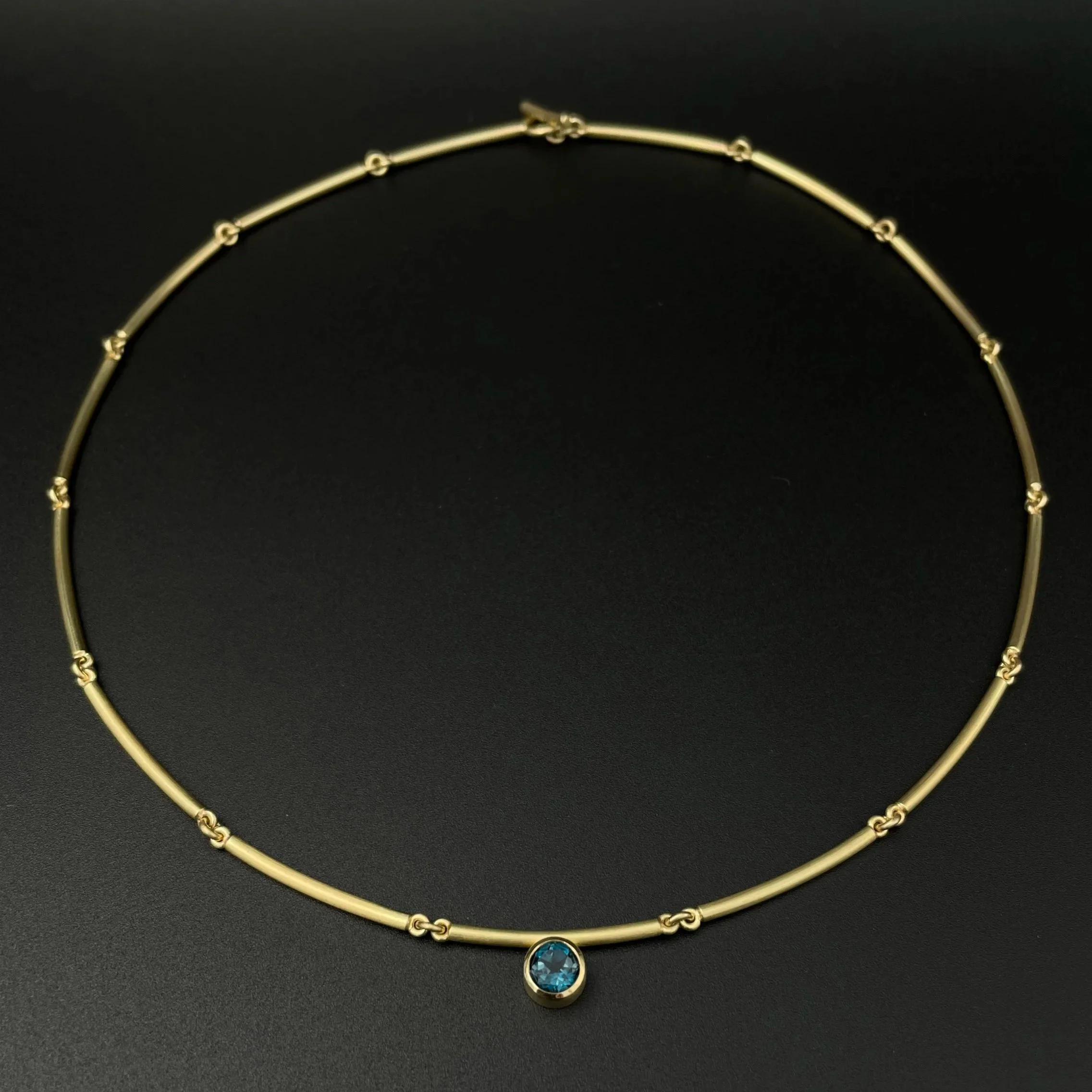 Topaz18KBarchainNecklace_layingBlack.jpg