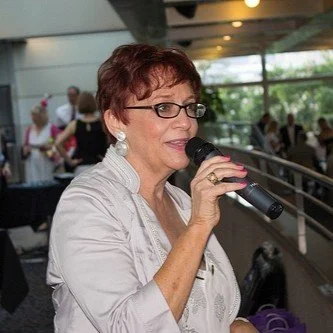 Woman speaking into a microphone