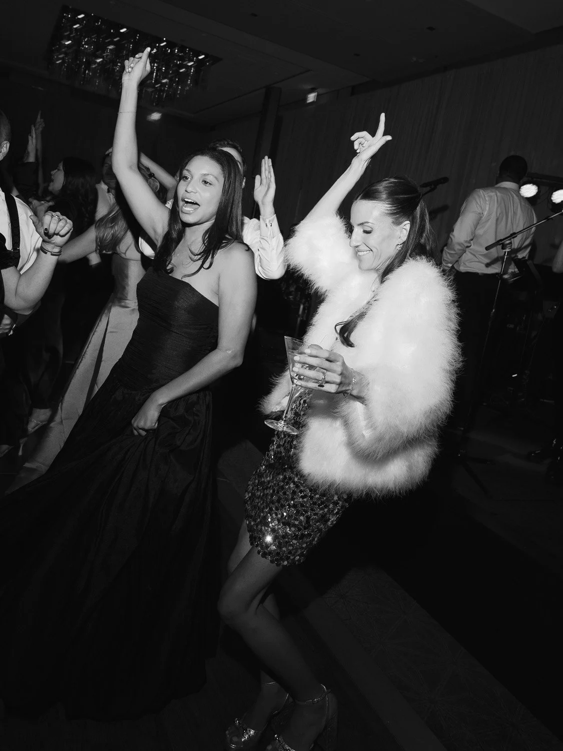 People dancing and enjoying music at a party or celebration.
