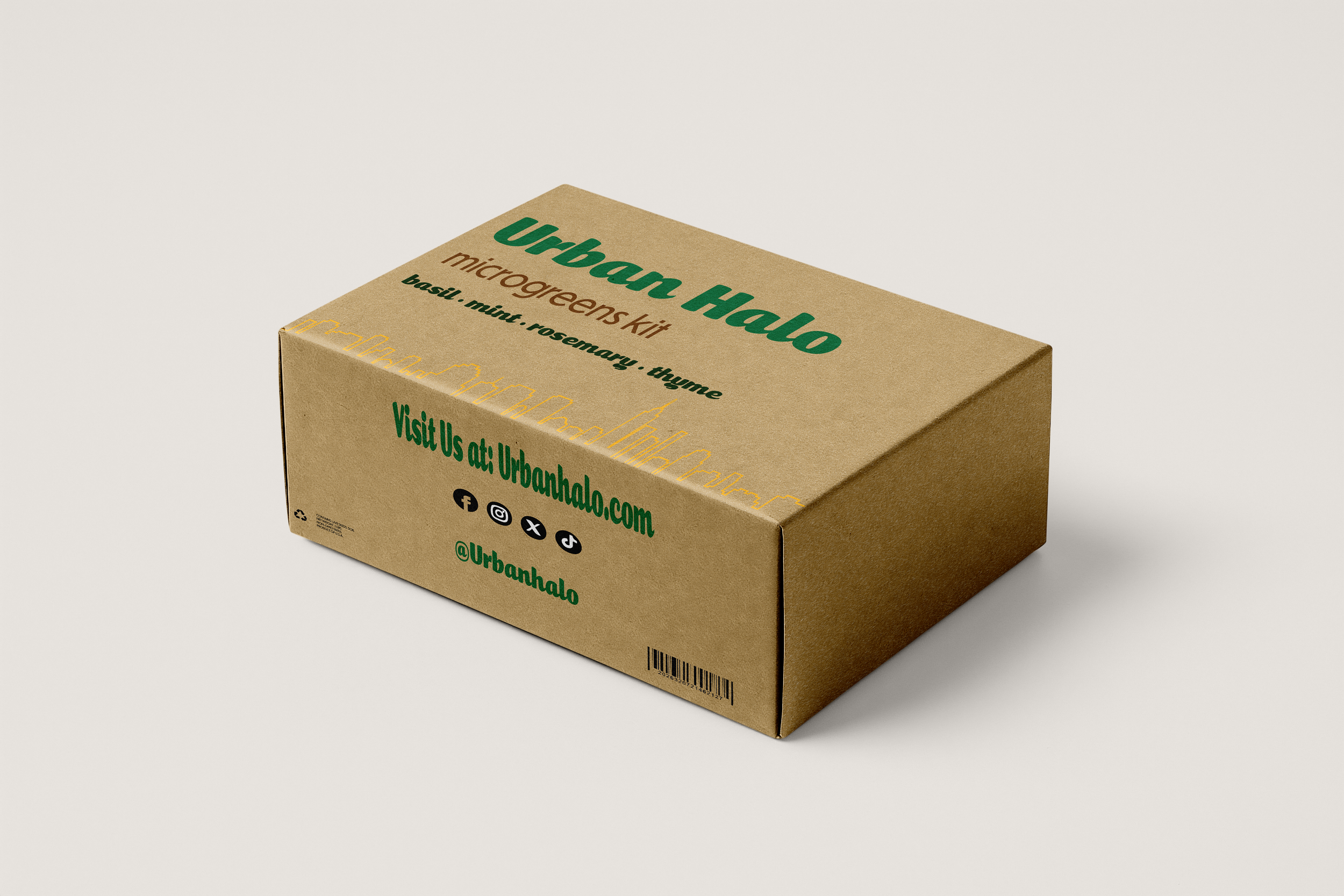 Brown cardboard box with green and black text about an Urban Halo microgreens kit, featuring a cityscape outline, social media icons, and website URL on a plain white background.