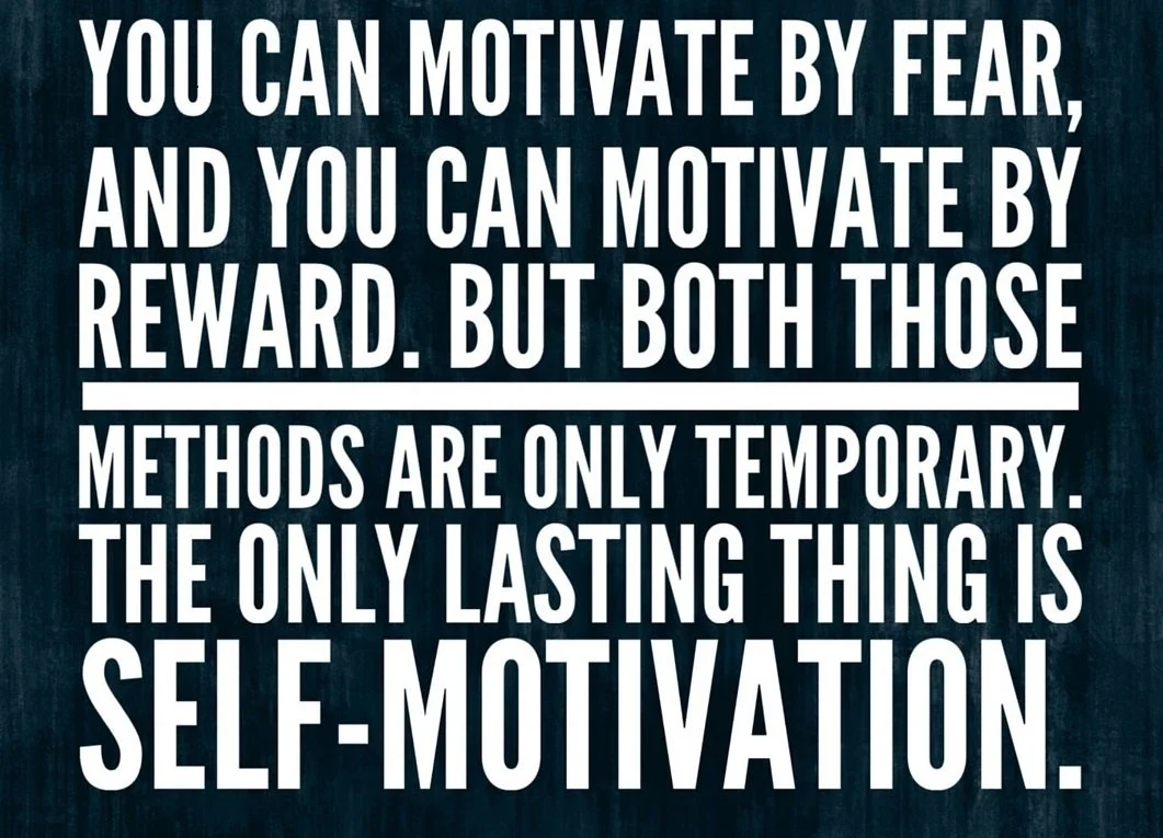 Motivational quote about self-motivation, fear, and reward with bold white text on a dark textured background.