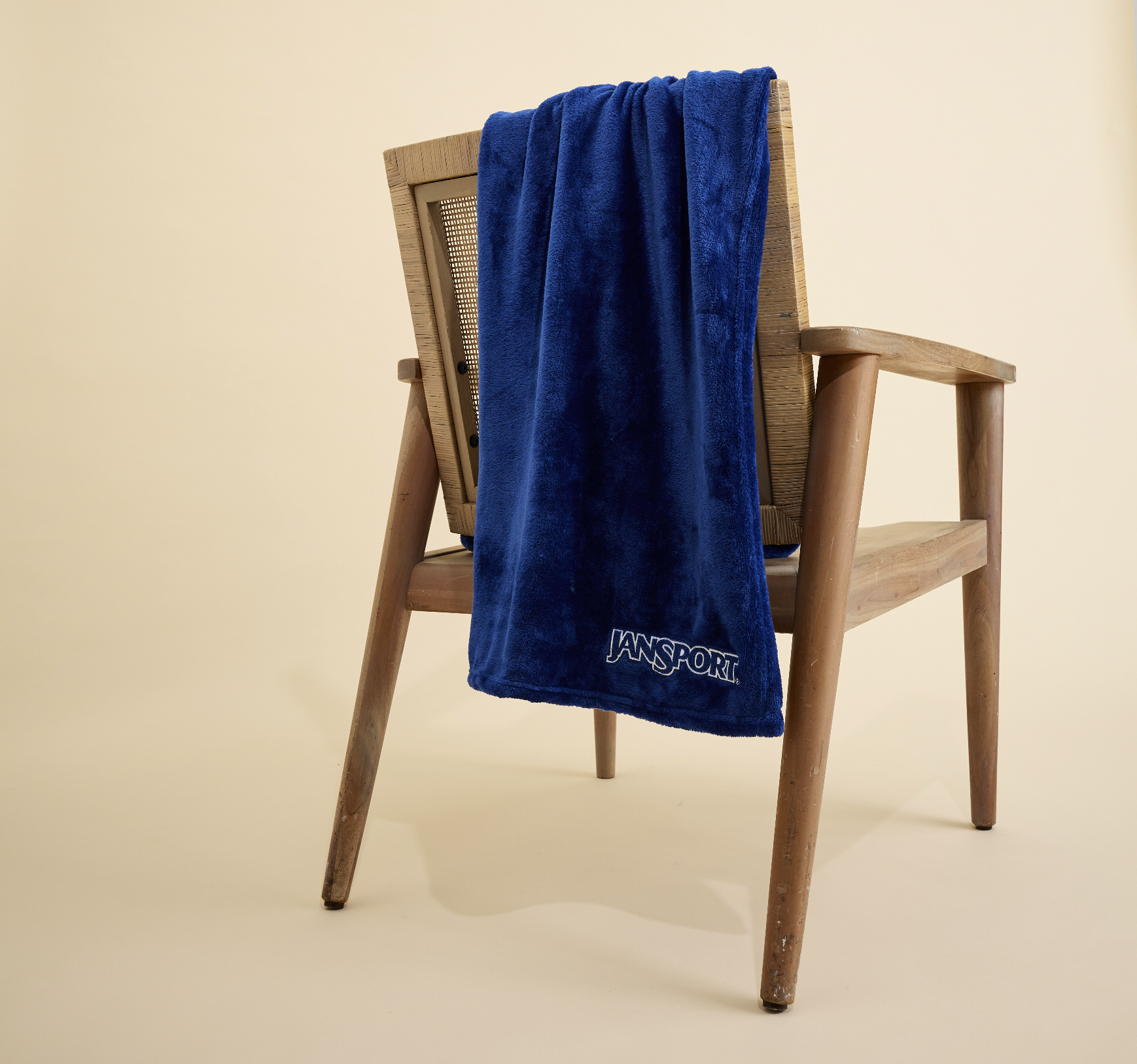 HOL25 JanSport GWP Blanket propped.png