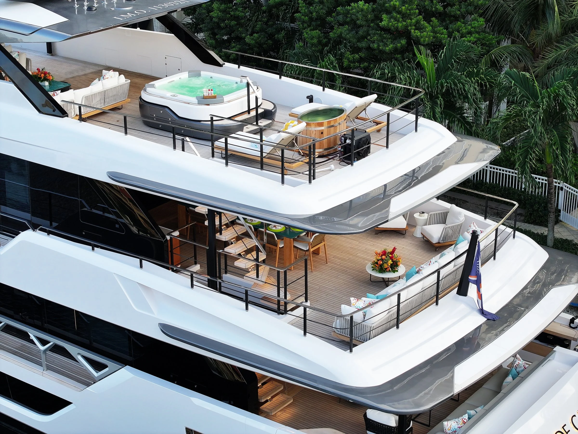 Wide exterior view of all decks on a luxury superyacht at sea