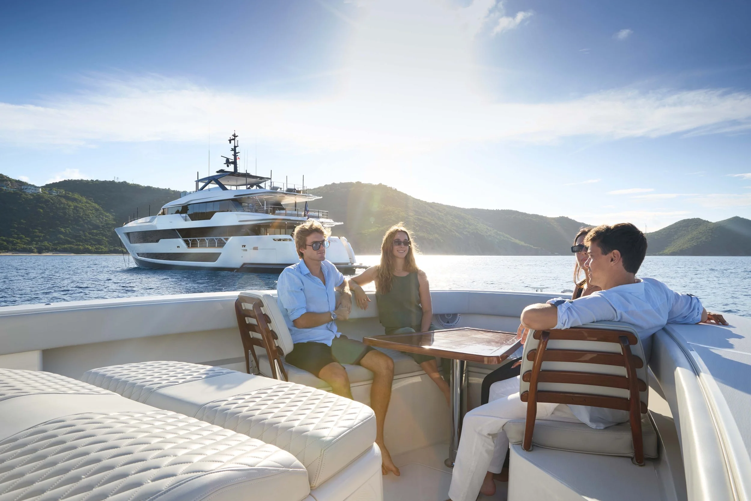 Luxury yacht viewed from a smaller boat on the ocean