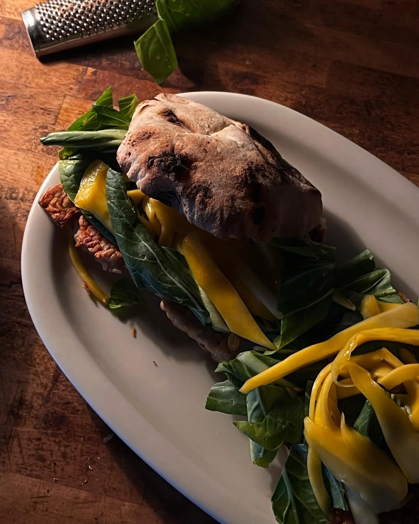 Tempeh Burger
Soy Tempeh, Wallnut Miso Creme, Bok Choi, Mango Slices marinated in Rice Vinegar

#tempeh
#miso
#kitchenalchemy
