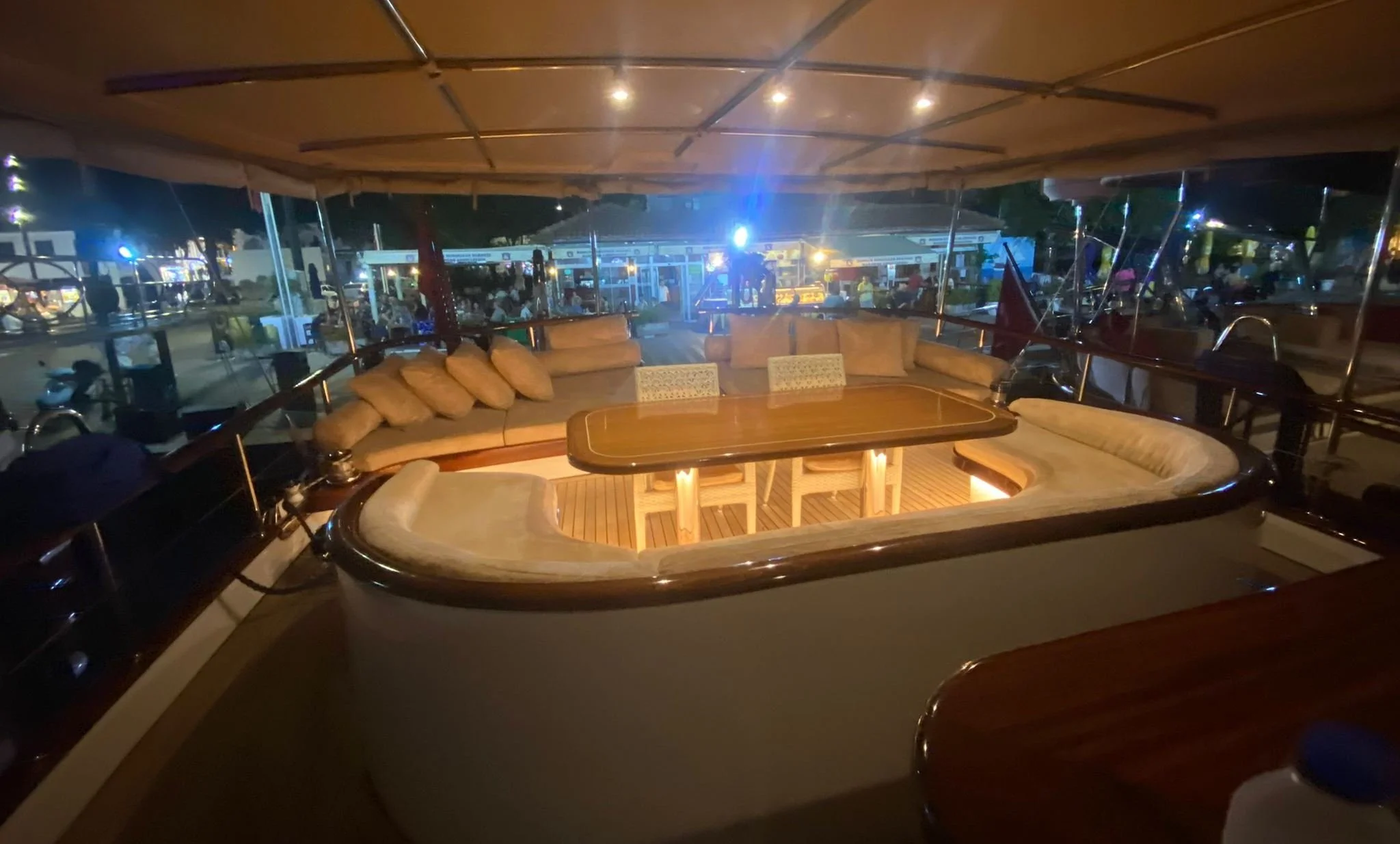 Nighttime marina view from inside a private gulet