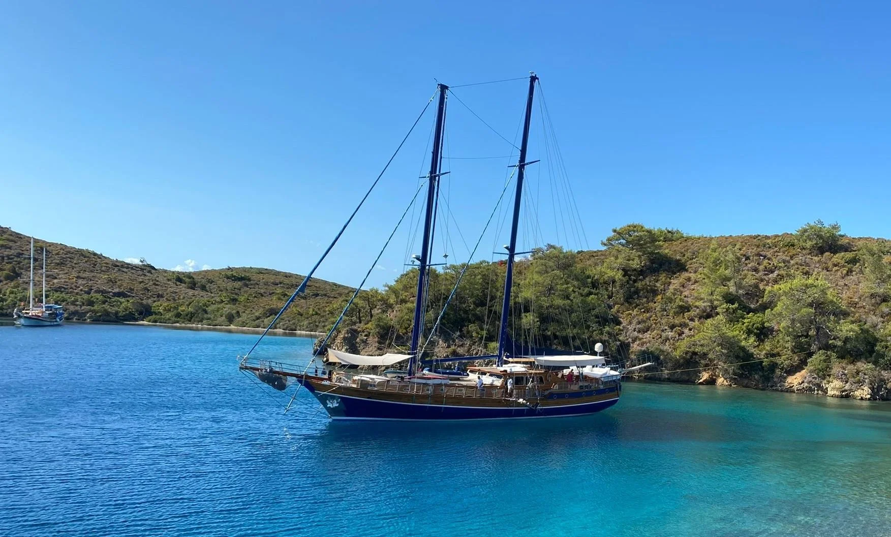 Private gulet anchored in clear blue water near Bodrum.