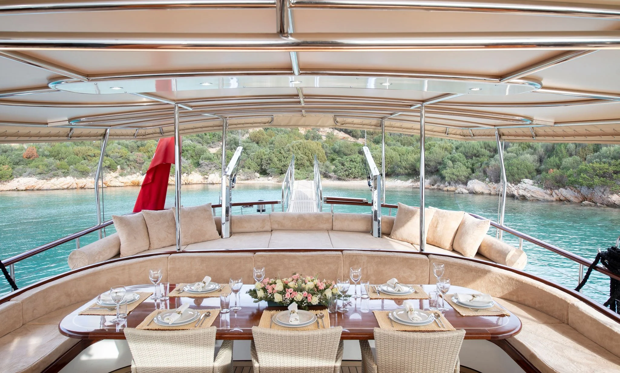 Outdoor gulet dining area overlooking the Bodrum coastline.