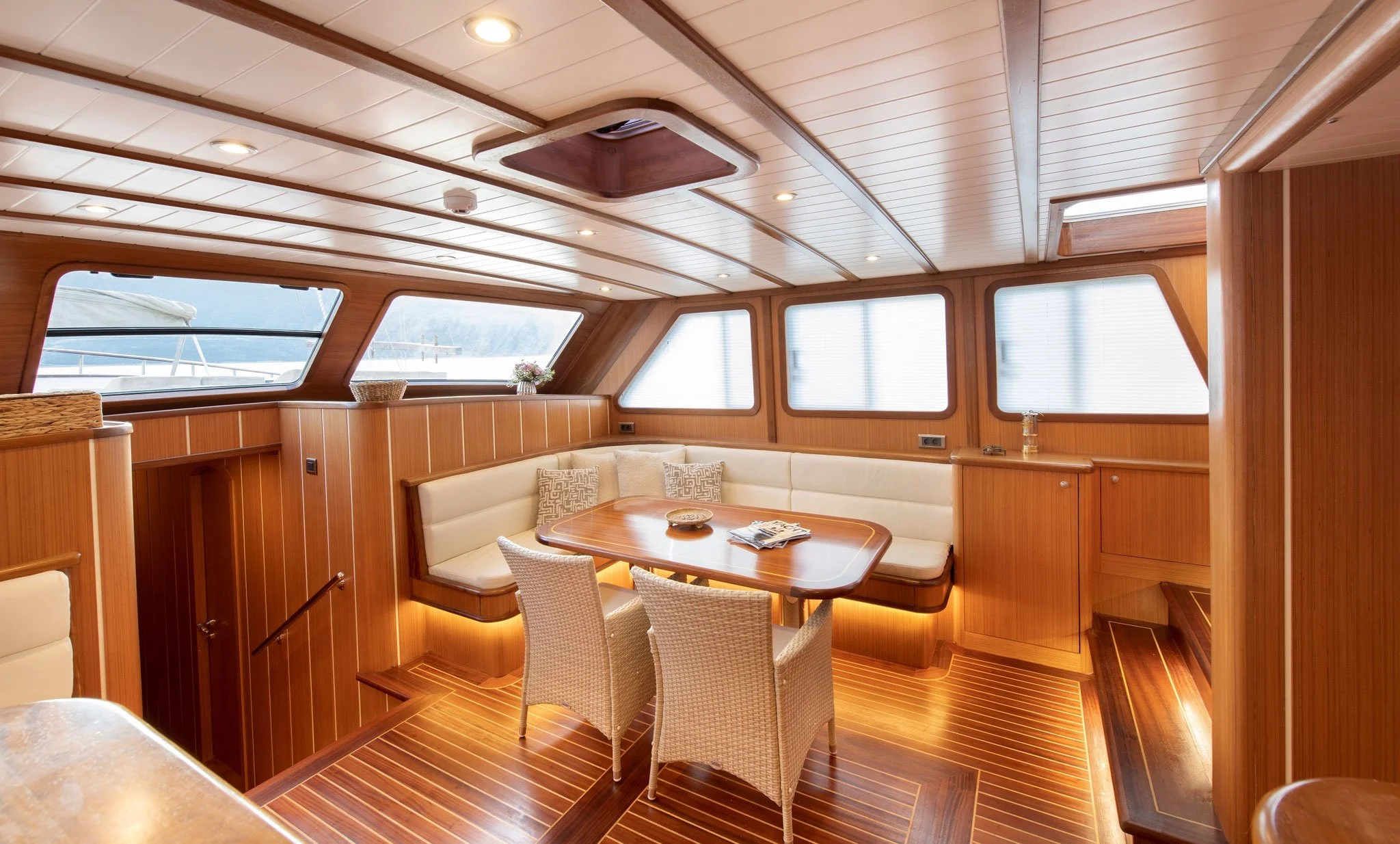 Wooden interior lounge inside a private gulet.