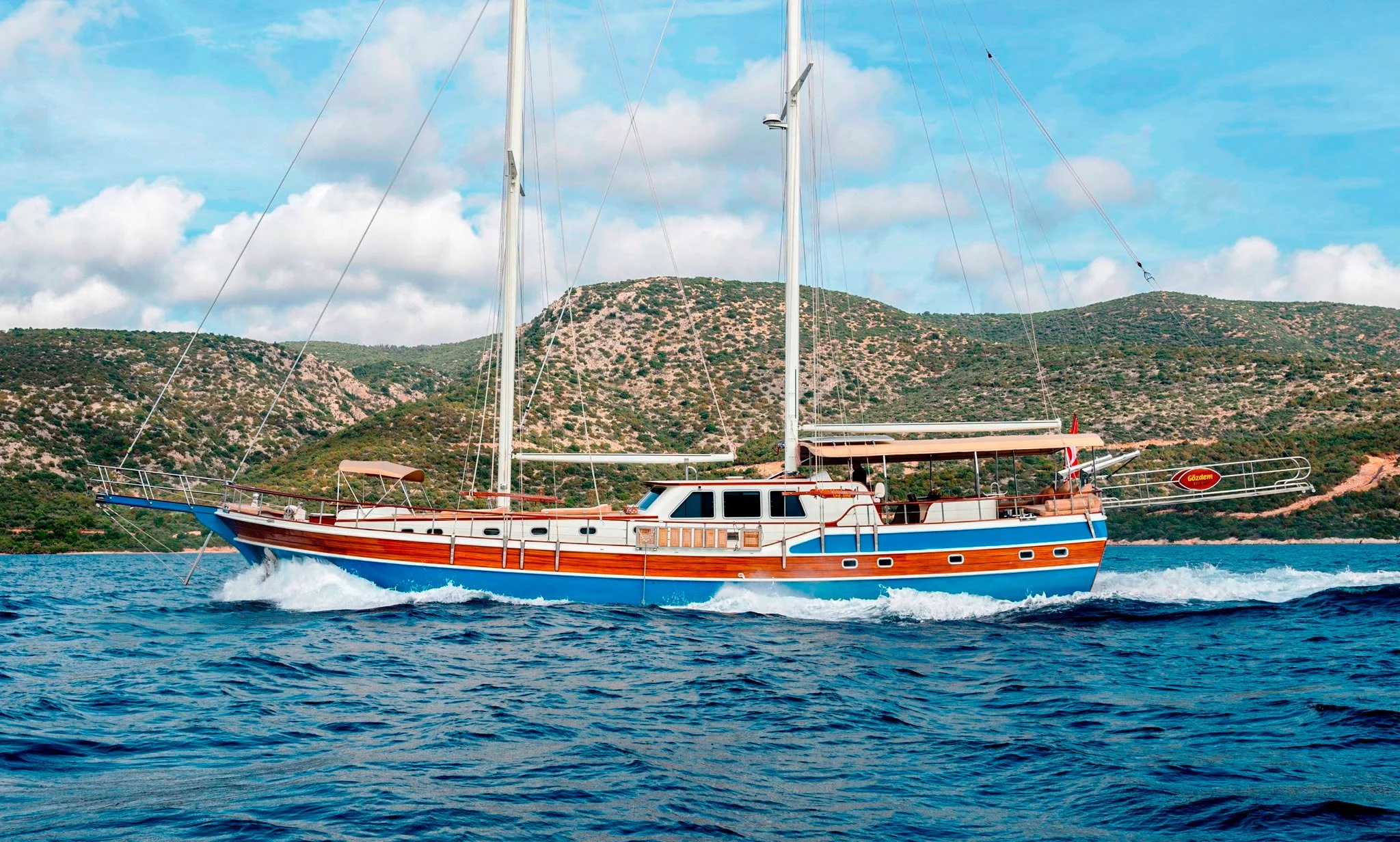 Traditional wooden gulet sailing along the Bodrum coastline.