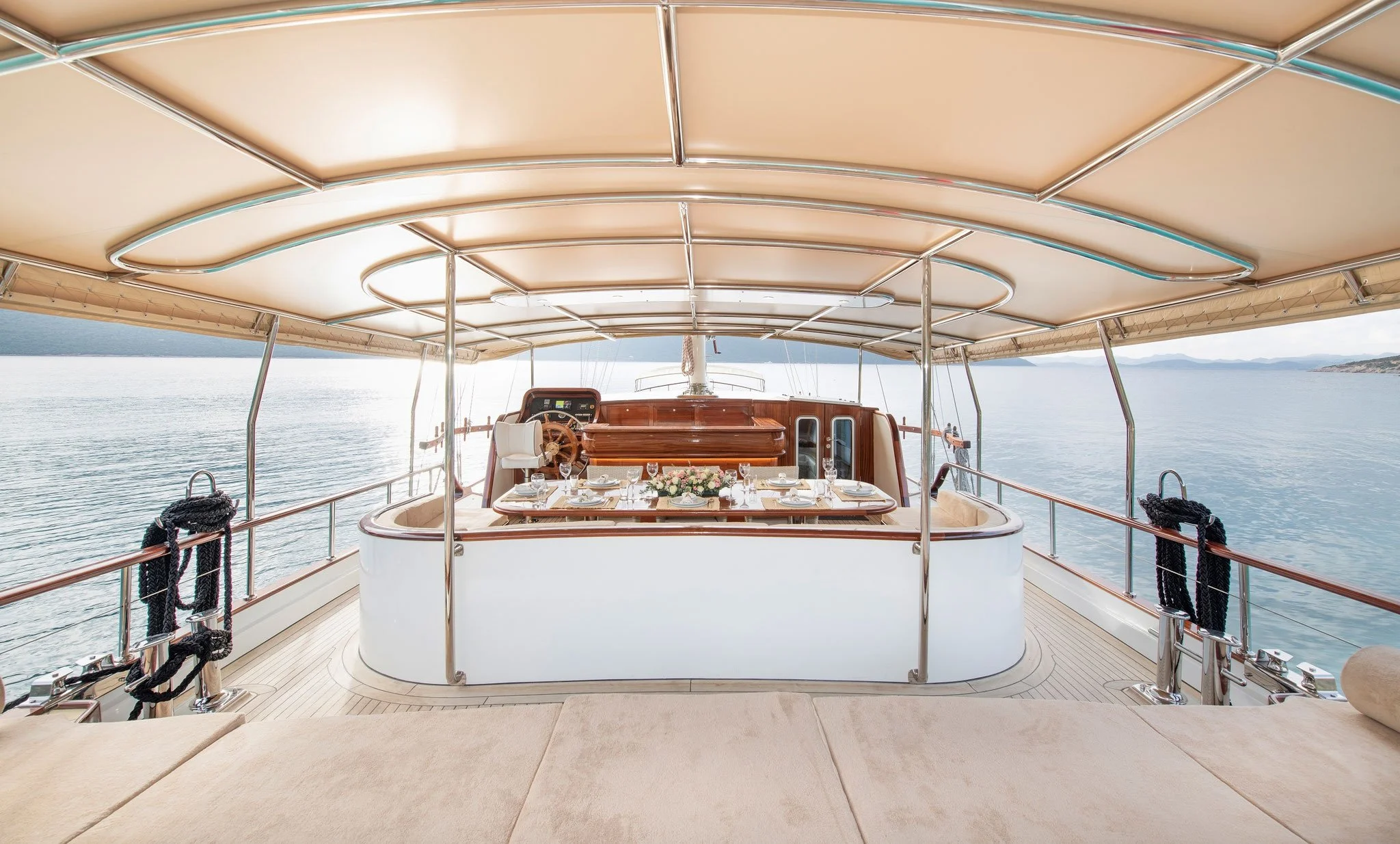 Private gulet deck dining setup on calm water.