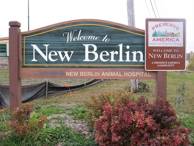 Welcome to New Berlin sign at the New Berlin Animal Hospital, with a Preserve America sign on the right.