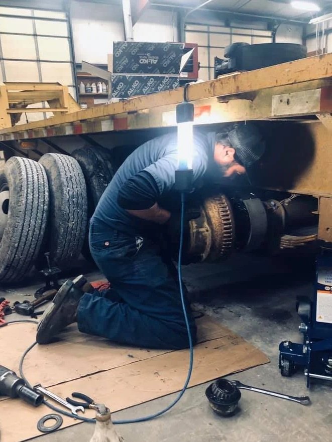 Stanley Heckman, owner of CSH Trailers & Automotive Services in Westphalia, MO, repairing a trailer.