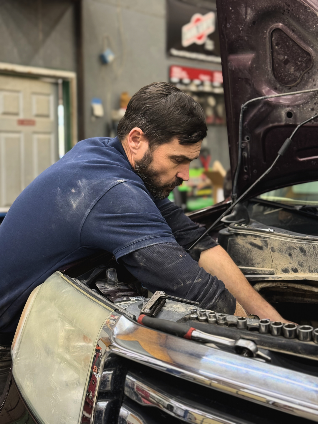 Stanley Heckman, owner of CSH Trailers & Automotive Services in Westphalia, MO, repairing a vehicle
