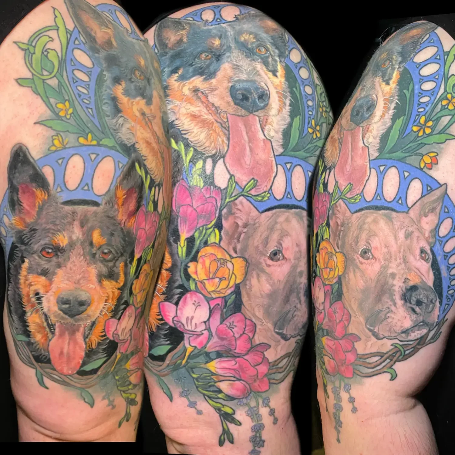 Color pet portrait tattoos of dogs surrounded by flowers on thigh. Custom Design by RVA tattoo artist Fronkie.