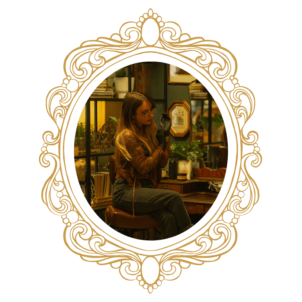 Dana, owner of Nostalgia Tattoo and tattoo artist specializing in illustrative and neo traditional designs.