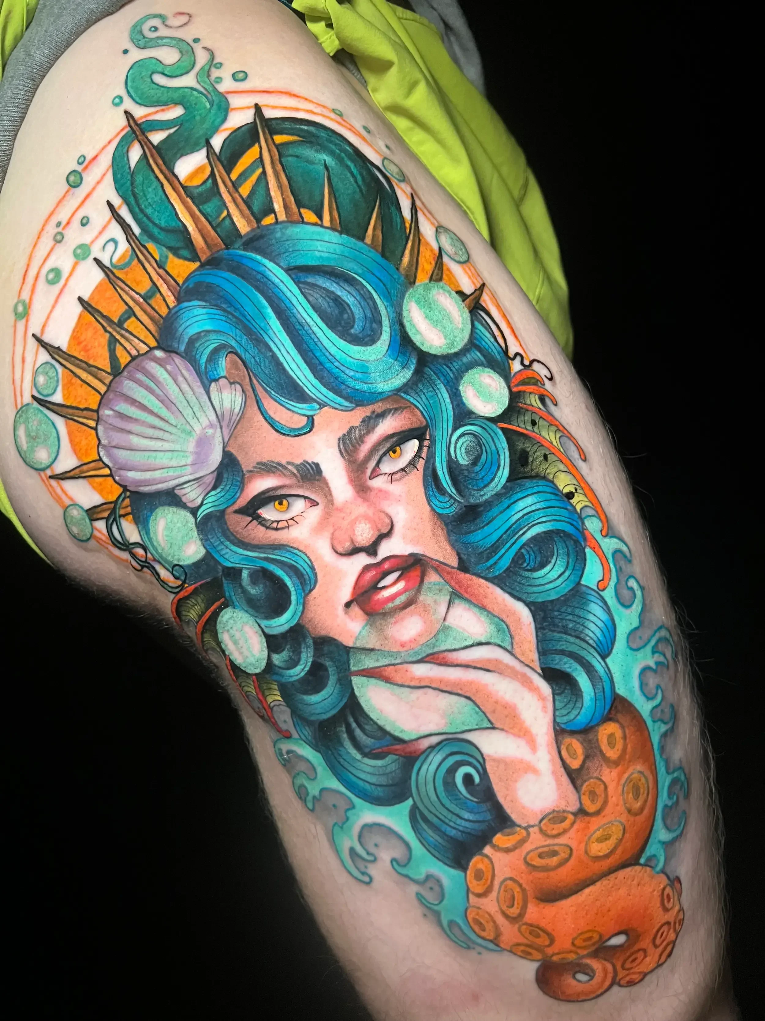 Neo-traditional color fantasy tattoo of a mermaid with blue hair over octopus tentacle.  Custom Design by female tattoo artist Dana Carlson in RVA.