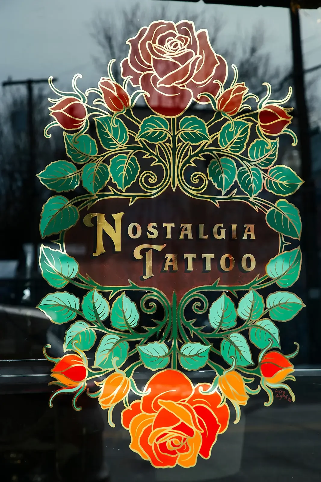 Nostalgia Tattoo sign on the entrance to Nostalgia Tattoo located Brookland Park Boulevard. in Richmond's Northside.