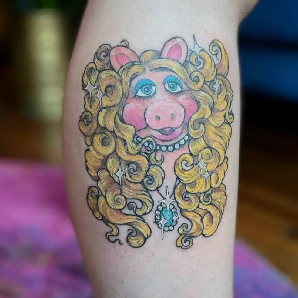 Color tattoo of a Miss Piggy in an American Traditional style. Custom design by Jess, tattoo artist in Richmond, Virginia.