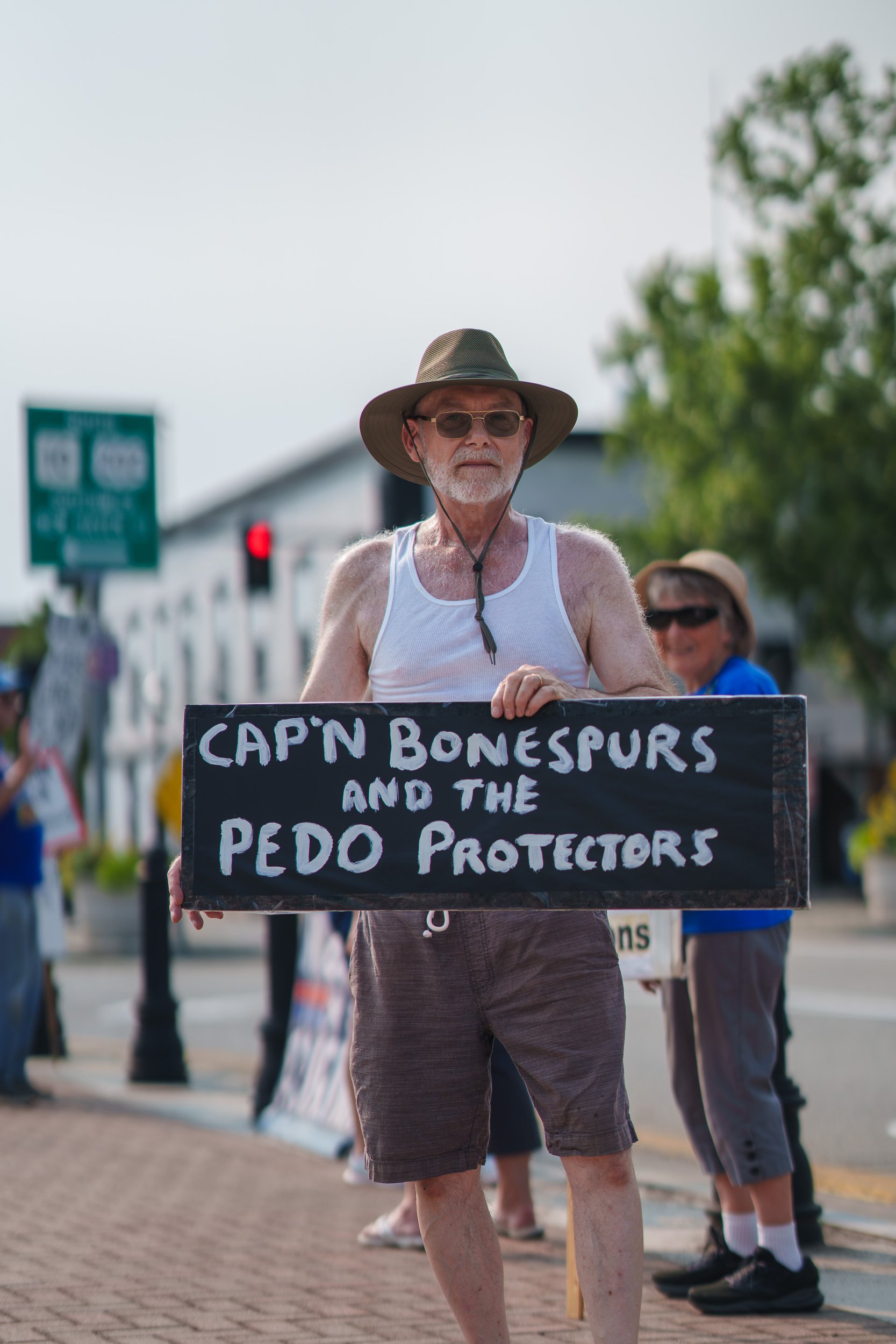 A man holding a sign to admonish President Trump poses for a portrait during the July 7, 2026 No Kings protest in Westfield, Ma. This day marks the 71st week of continued protest in Westfield against the current political administration.

(Photo by S