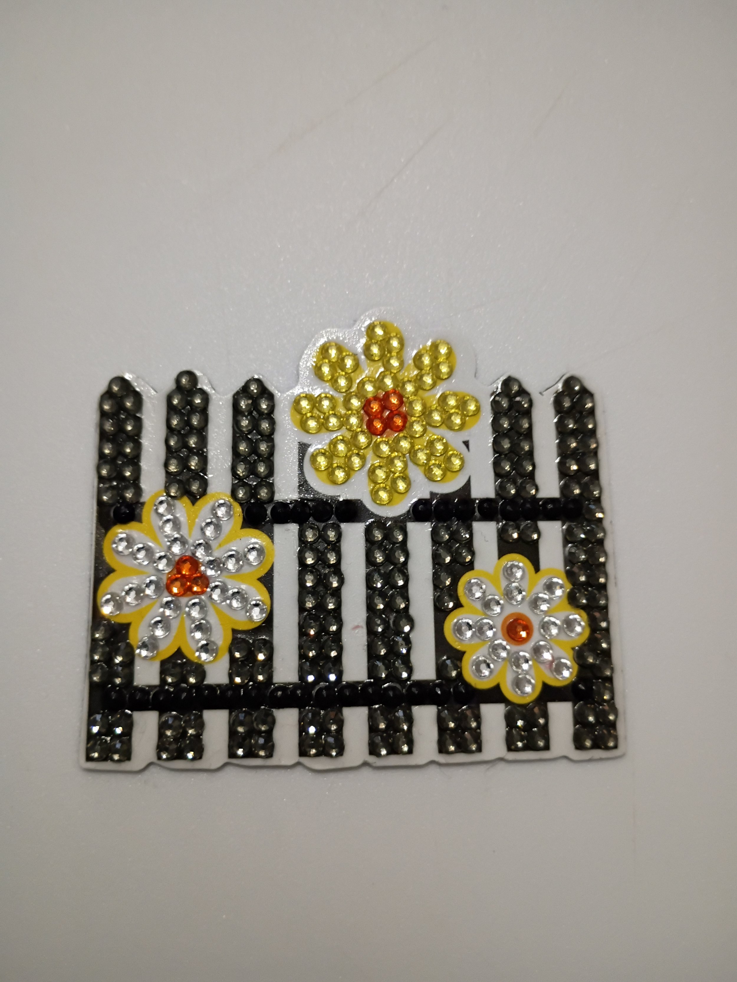 black fence bee magnet