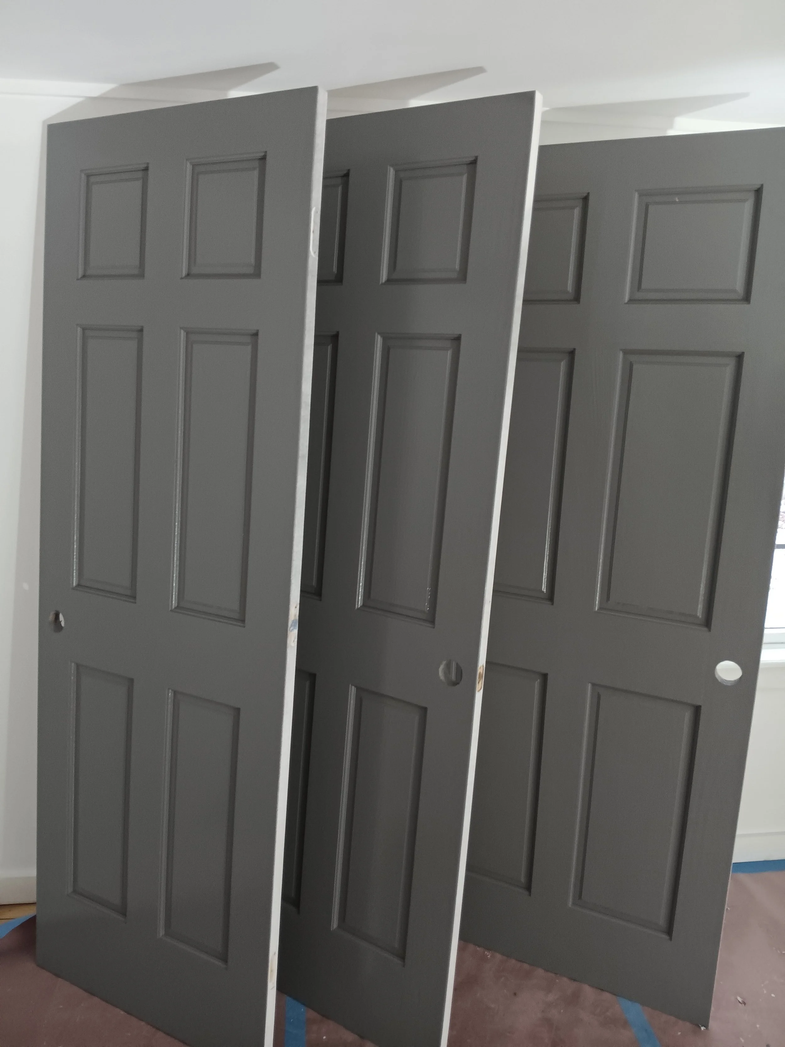 Solid Pine door slabs that we sprayed primer/sanded/cleaned/and sprayed finish at a Job located right by The Great Sacandaga Lake.