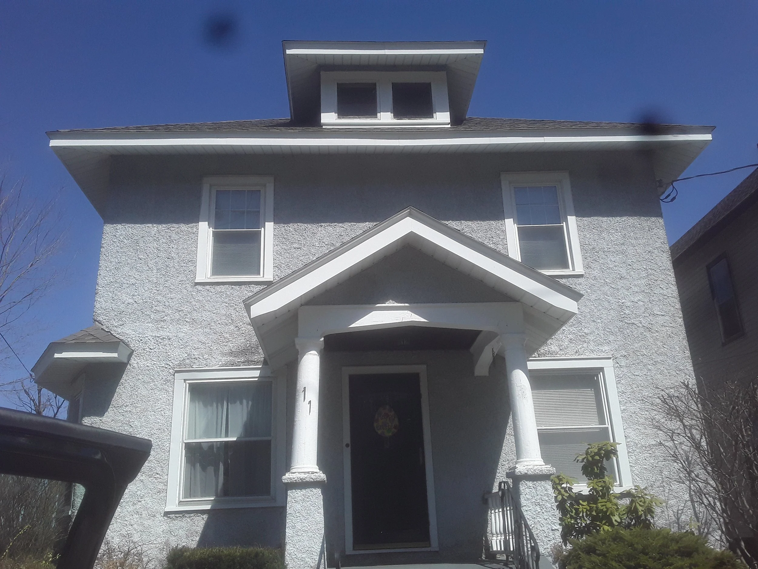 Stucco House in Amsterdam NY before pressure washing and painting.