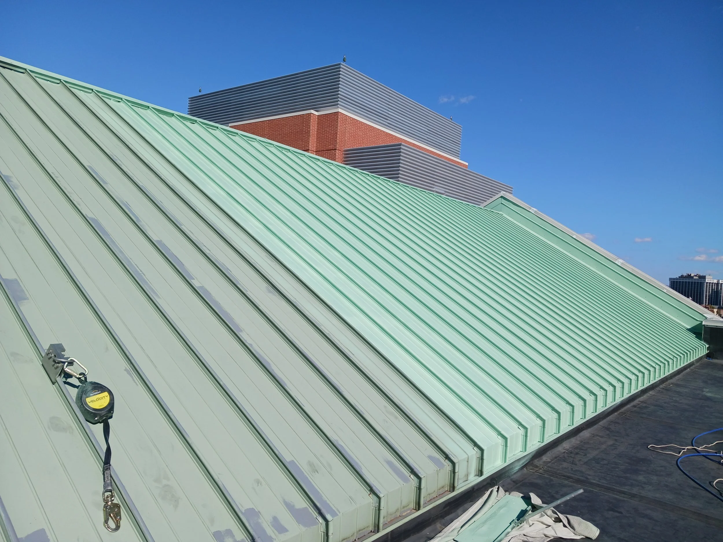 Commercial job at Albany NY Medical Center that is in the process of finish paint after properly pressure washed and spot primed minor surface rust.