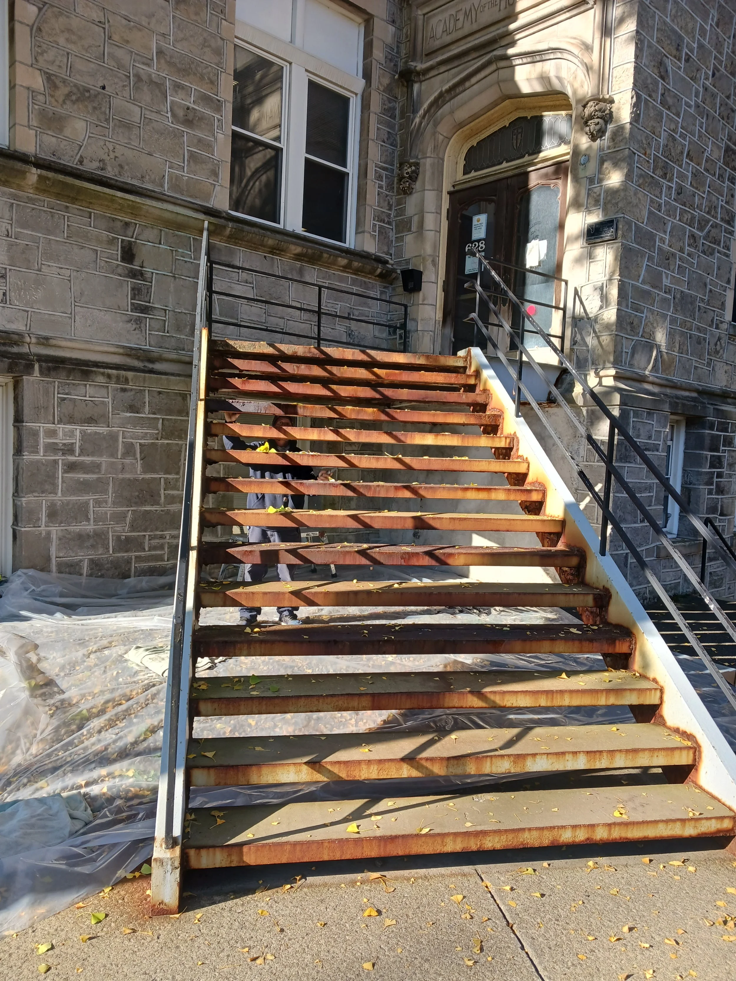 Medical Building in Albany that the staircase was in great need of scraping sanding priming with epoxy paint and finish coated.