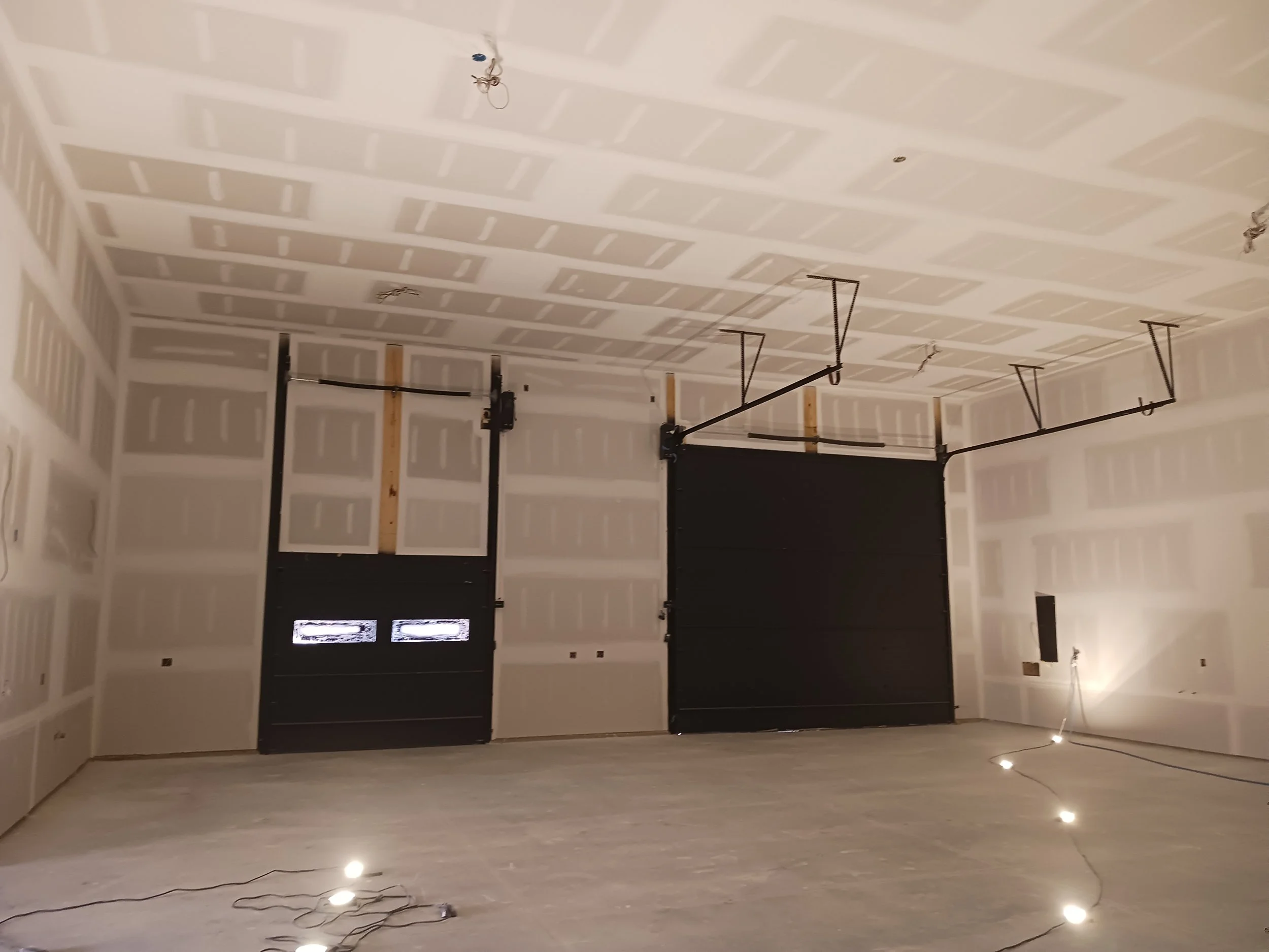 Local new construction Barn/garage in Greenfield NY. Overhead doors have been prepped/cleaned and sprayed with finish paint.