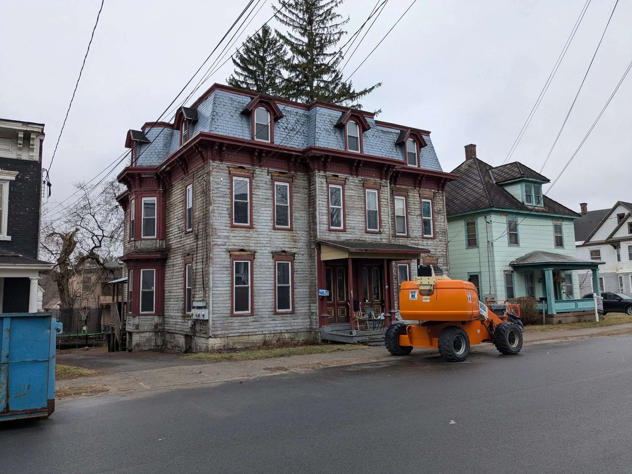 A contractor's rental properly that needed to be refinished. The existing siding on this old Victorian style house was grinded/ sanded down to raw wood, then primed,2 coats of finish paint and had a 6 different color scheme.