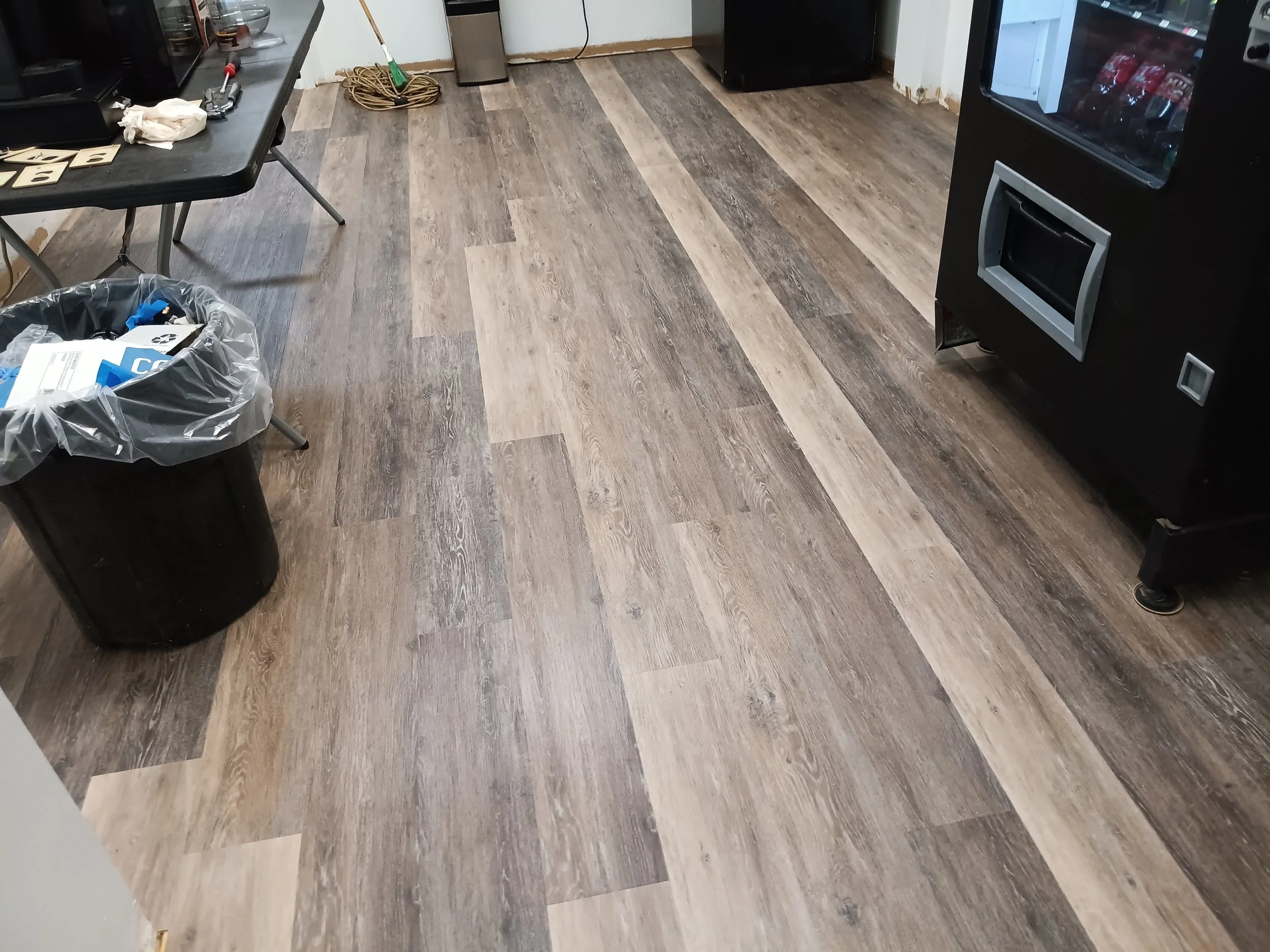 LVP flooring all installed and will be installing square stock baseboard around the perimeter to finish this job.