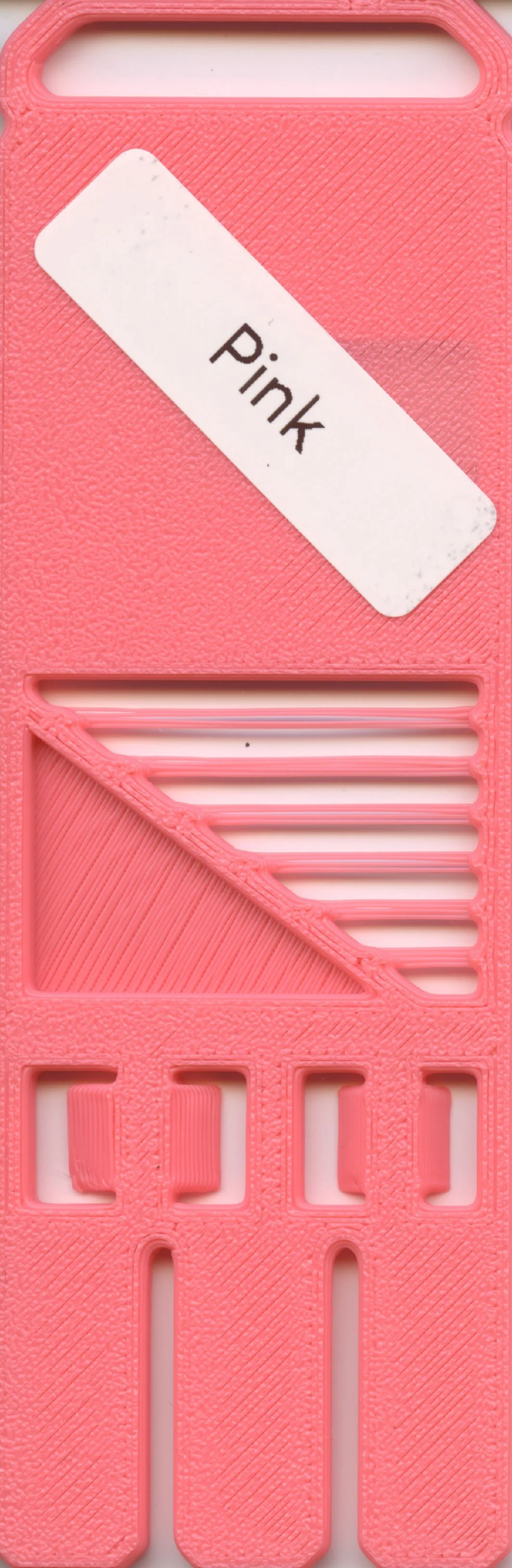 A pink plastic storage container with a label that reads "Pink."